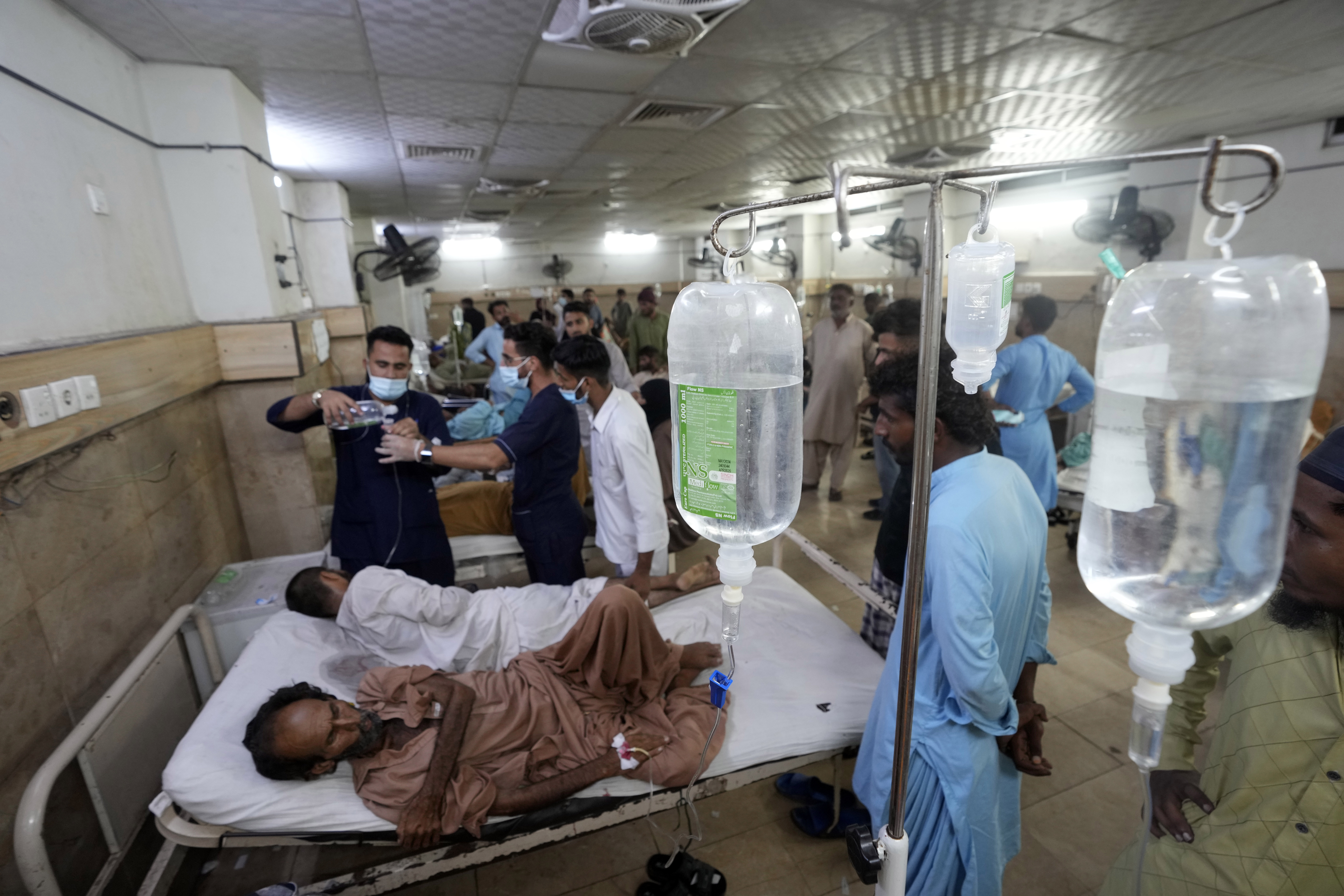 FILE - Heatstroke patients receive treatment at a hospital in Karachi, Pakistan, Thursday, July 25, 2024. (AP Photo/Fareed Khan,File)