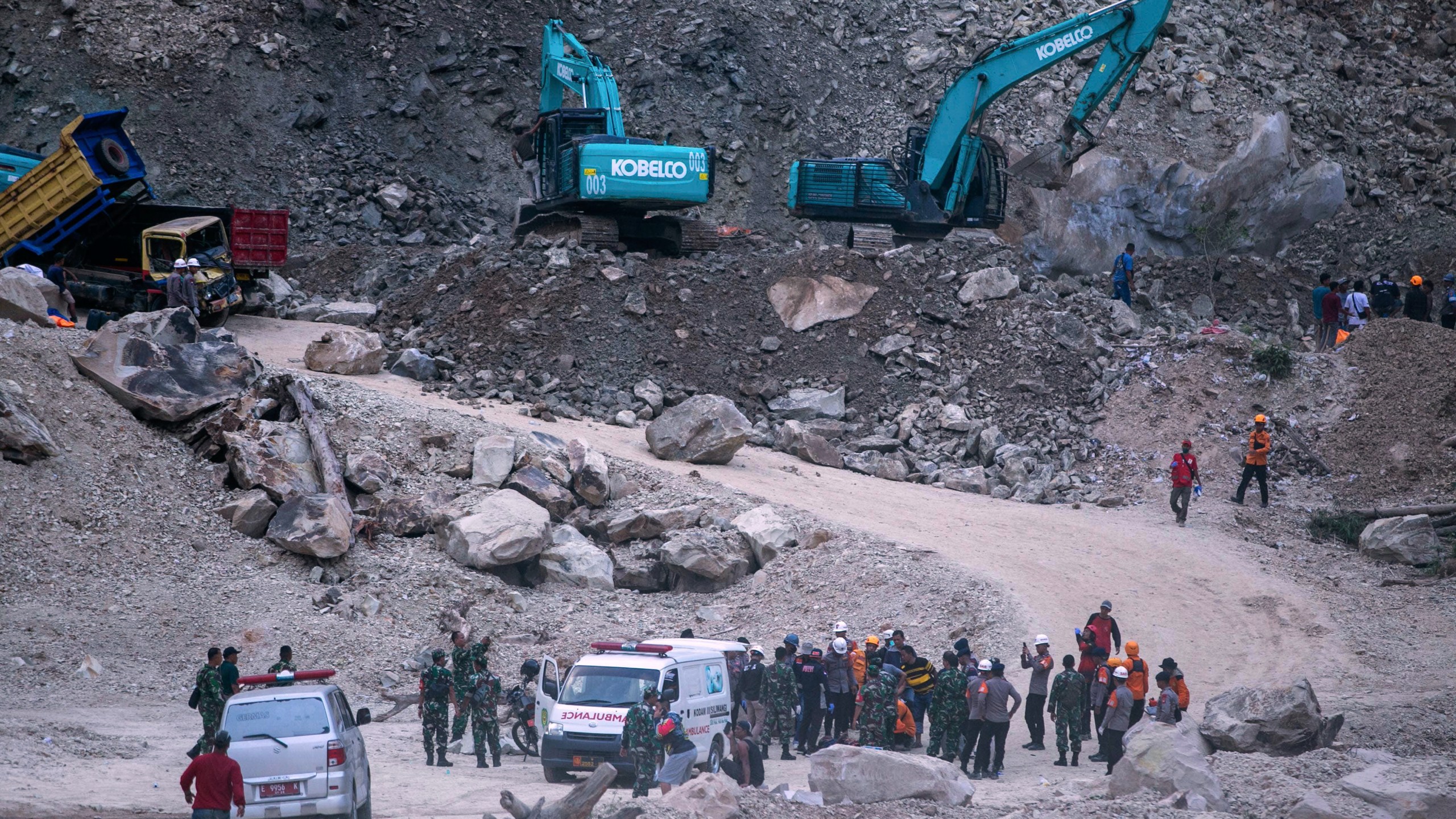 Rescuers search for victims after a natural stones quarry collapsed in Cirebon district , West Java province, Indonesia, Friday, 30, 2025. (AP Photo/Okri Riyana)