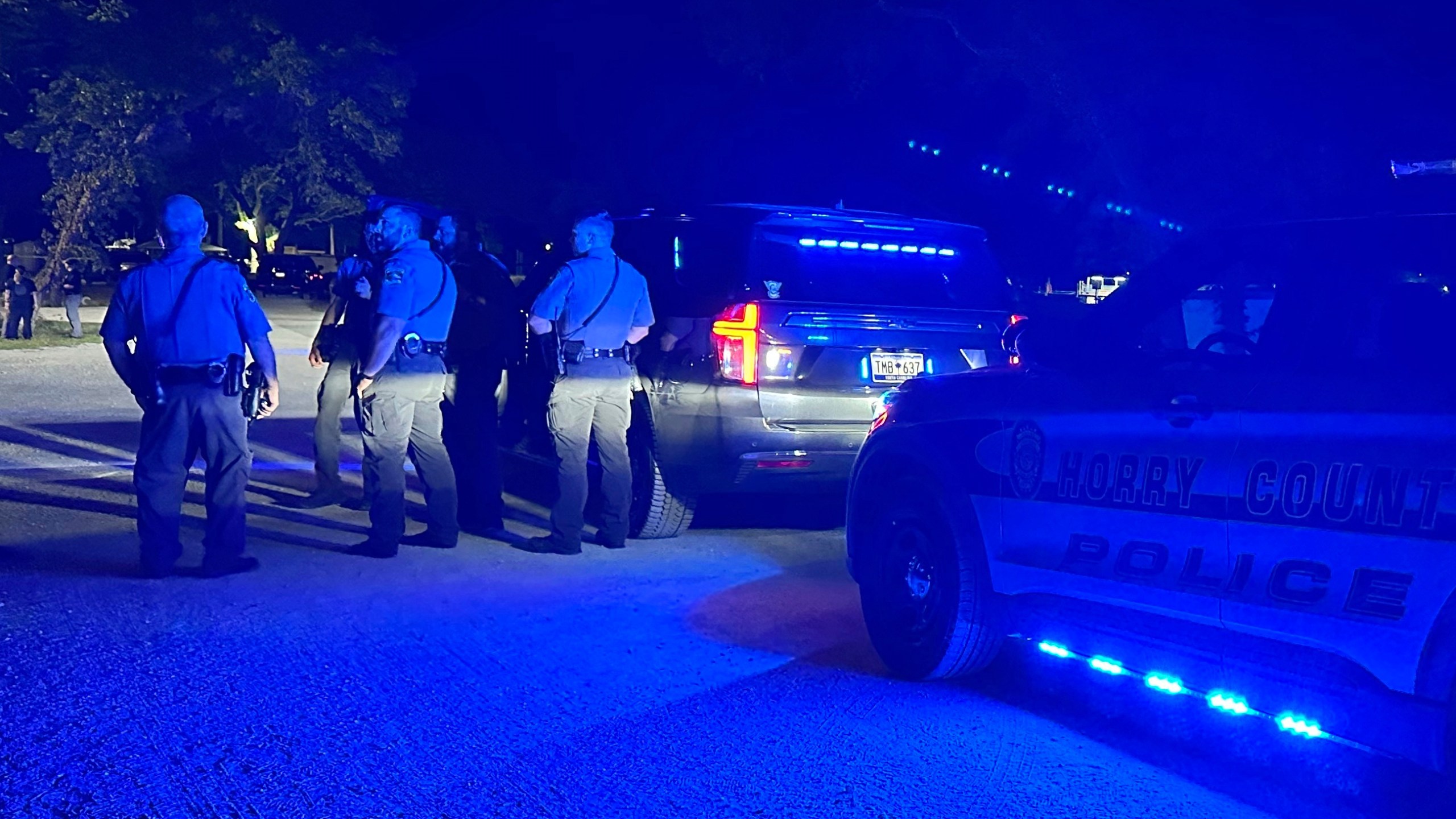 In this photo provided by the Horry County Police Department, police officers respond to the scene of a shooting on Sunday, May 25, 2025, in Little River, S.C. (Horry County Police Department via AP)