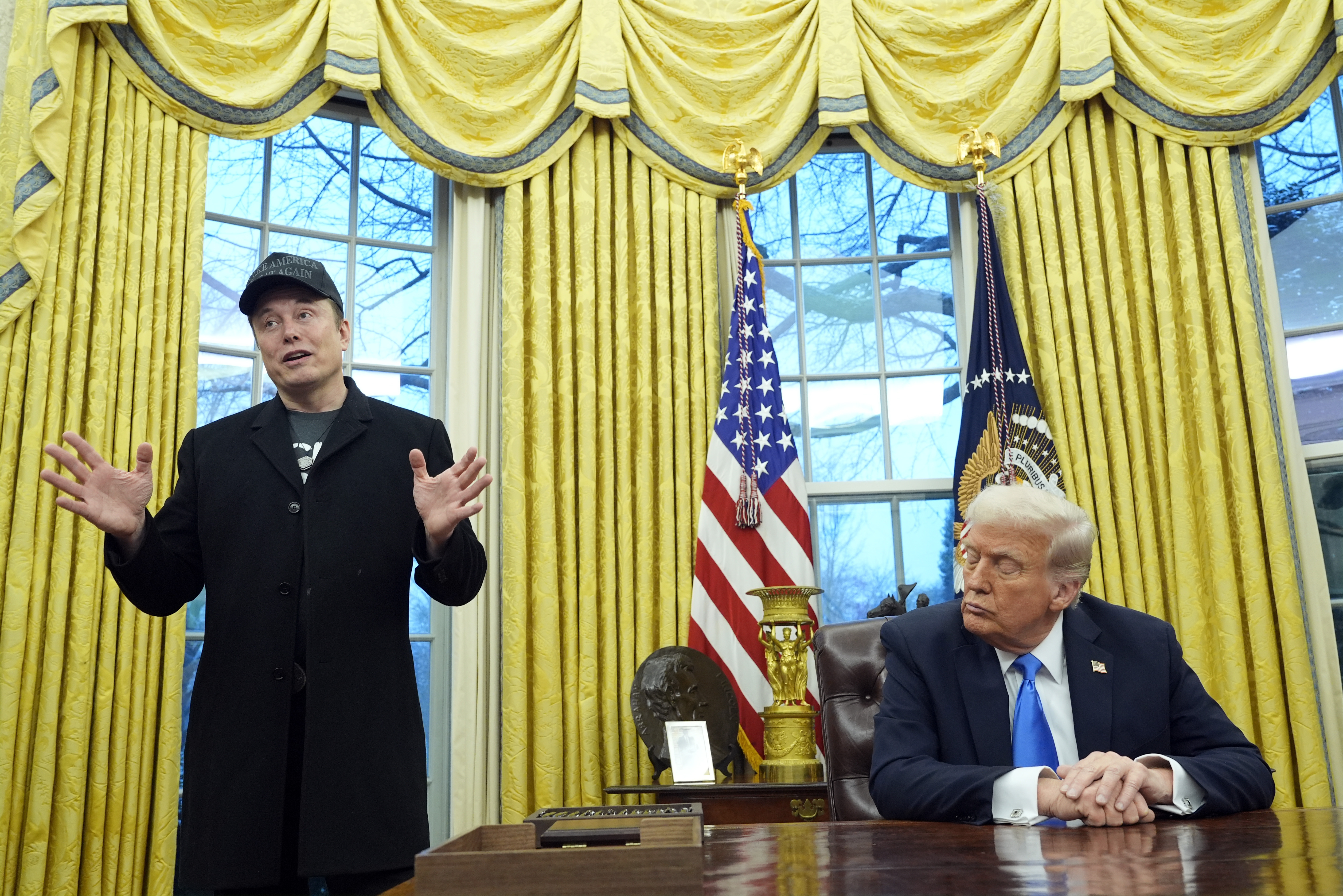 FILE - President Donald Trump listens as Elon Musk speaks in the Oval Office at the White House, Feb. 11, 2025, in Washington. (AP Photo/Alex Brandon, File)