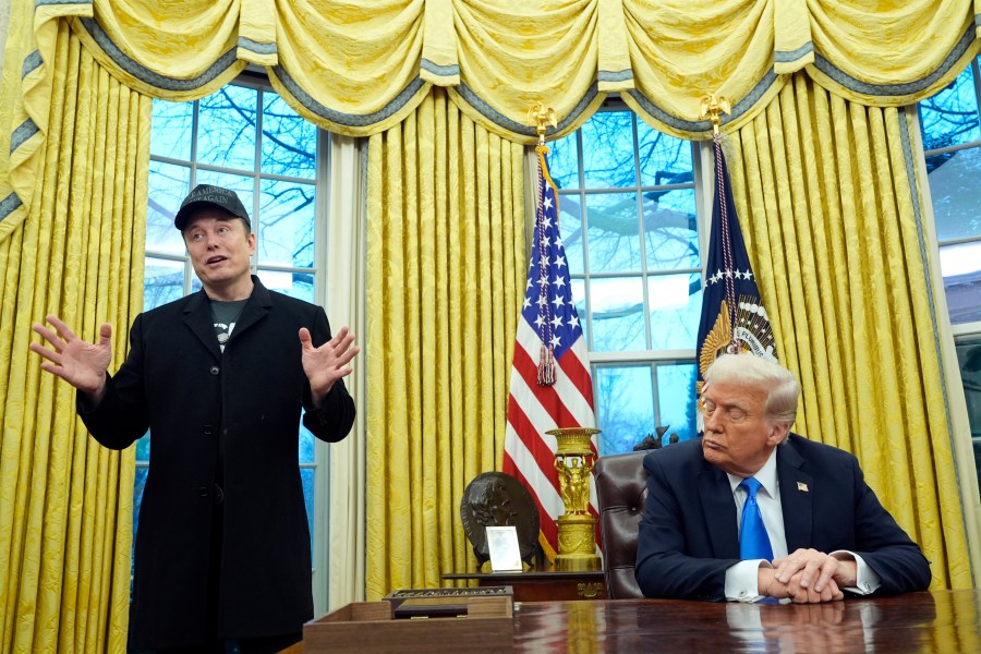 FILE - President Donald Trump listens as Elon Musk speaks in the Oval Office at the White House, Feb. 11, 2025, in Washington. (AP Photo/Alex Brandon, File)