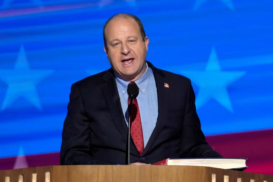 FILE - Colorado Gov. Jared Polis speaks during the Democratic National Convention, Aug. 21, 2024, in Chicago. (AP Photo/J. Scott Applewhite, File)