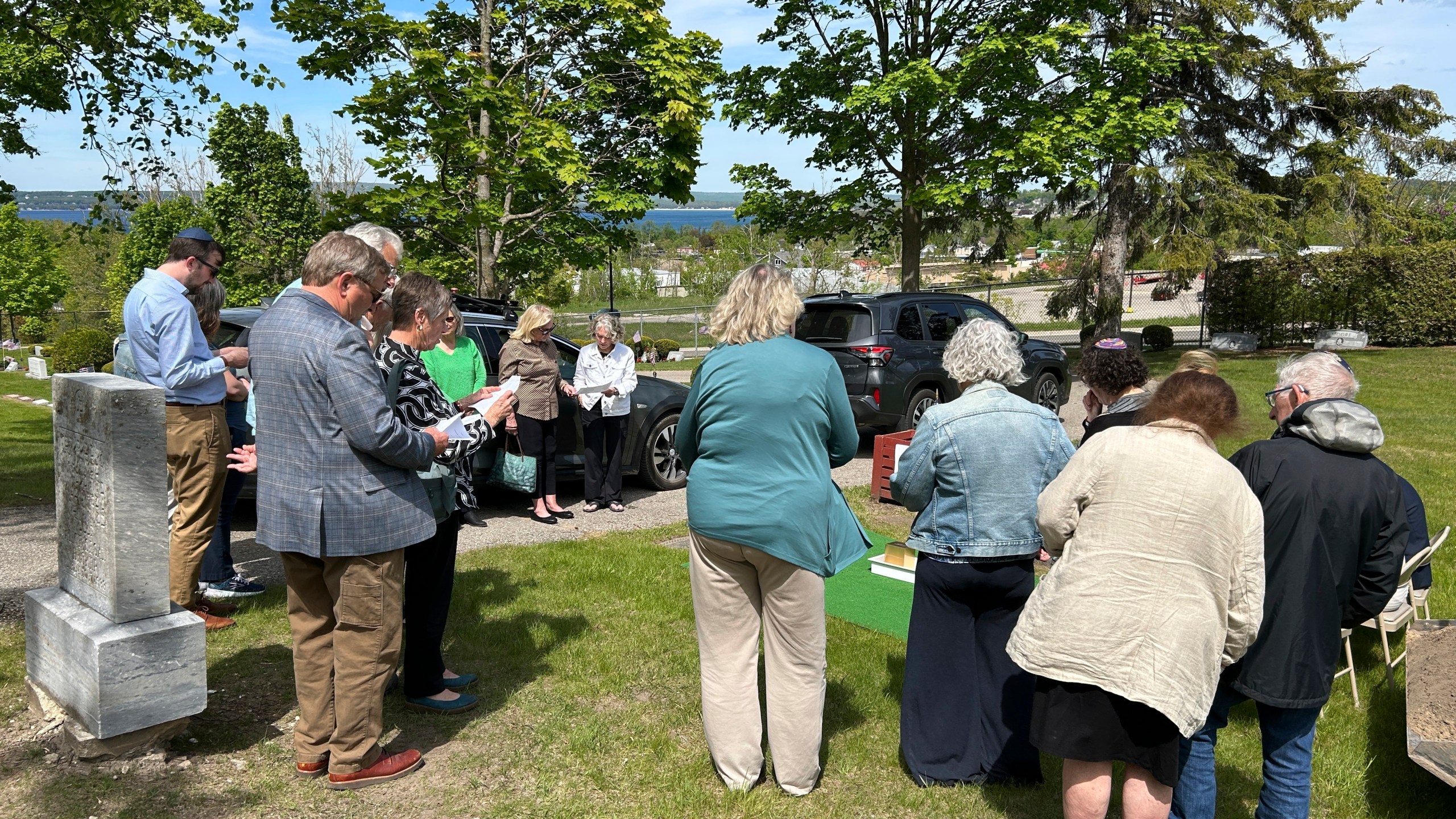 People gather at Greenwood Cemetery for the burial of Larry Rubin, former executive secretary of the Mackinac Bridge Authority, in Petoskey, Mich., Wednesday May 28, 2025. (Daniel Zivian via AP)