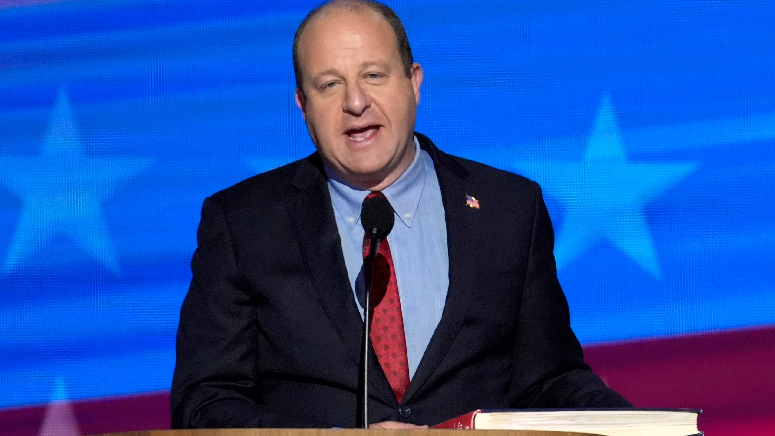 FILE - Colorado Gov. Jared Polis speaks during the Democratic National Convention, Aug. 21, 2024, in Chicago. (AP Photo/J. Scott Applewhite, File)