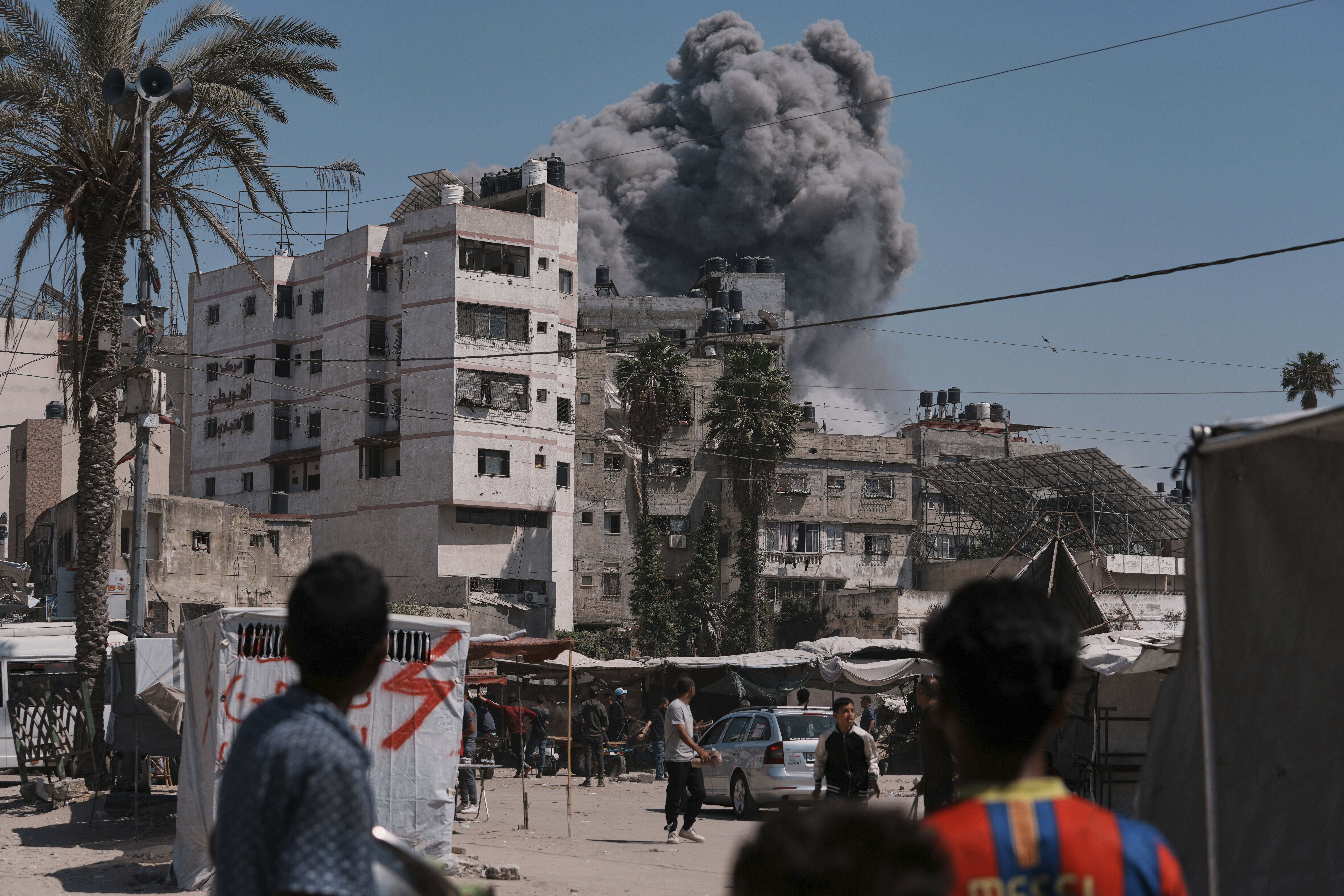 Smoke rises in the sky following an Israeli airstrike in Gaza City, Friday, May 30, 2025. (AP Photo/Jehad Alshrafi)