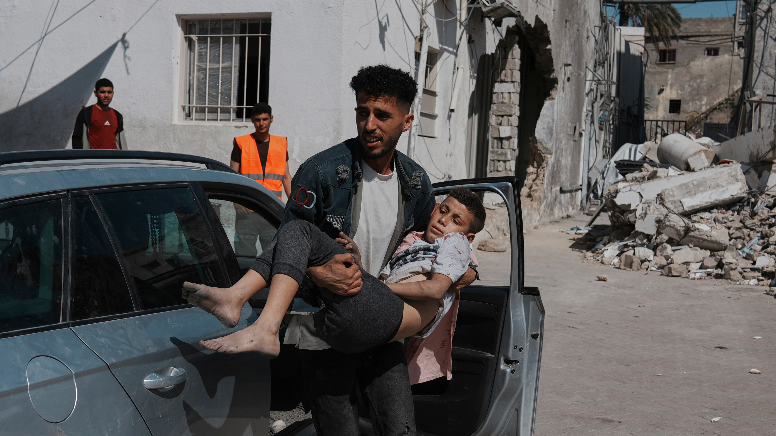 A Palestinian boy, injured following an Israeli airstrike, is brought for treatment to the Baptist Hospital in Gaza City, Friday, May 30, 2025. (AP Photo/Jehad Alshrafi)