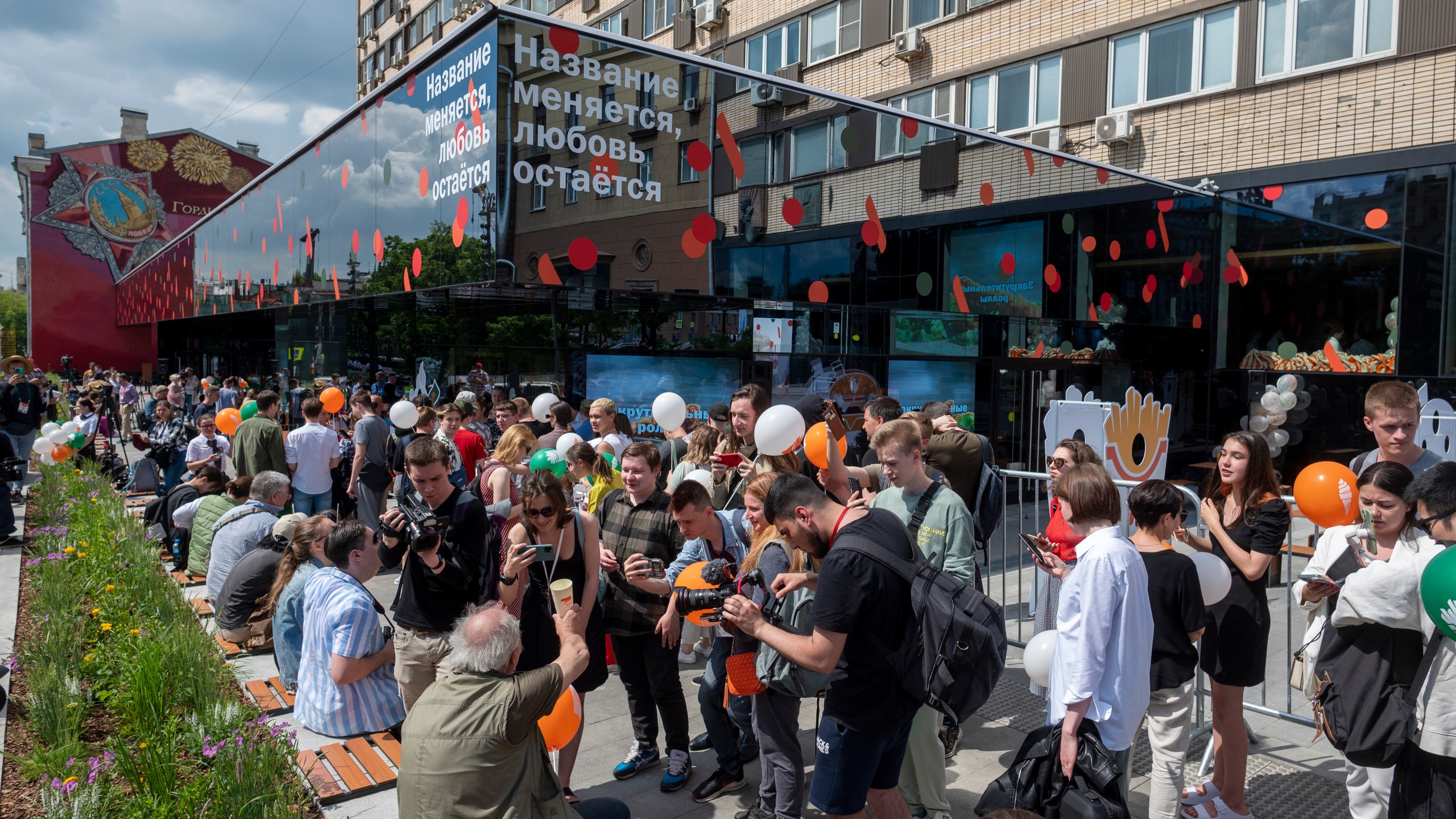 FILE - People line up to visit a newly opened fast food restaurant in a former McDonald's outlet in Bolshaya Bronnaya Street in Moscow, Russia, Sunday, June 12, 2022. The sign reads "The Name Changes, Love Remains." (AP Photo/Dmitry Serebryakov, File)