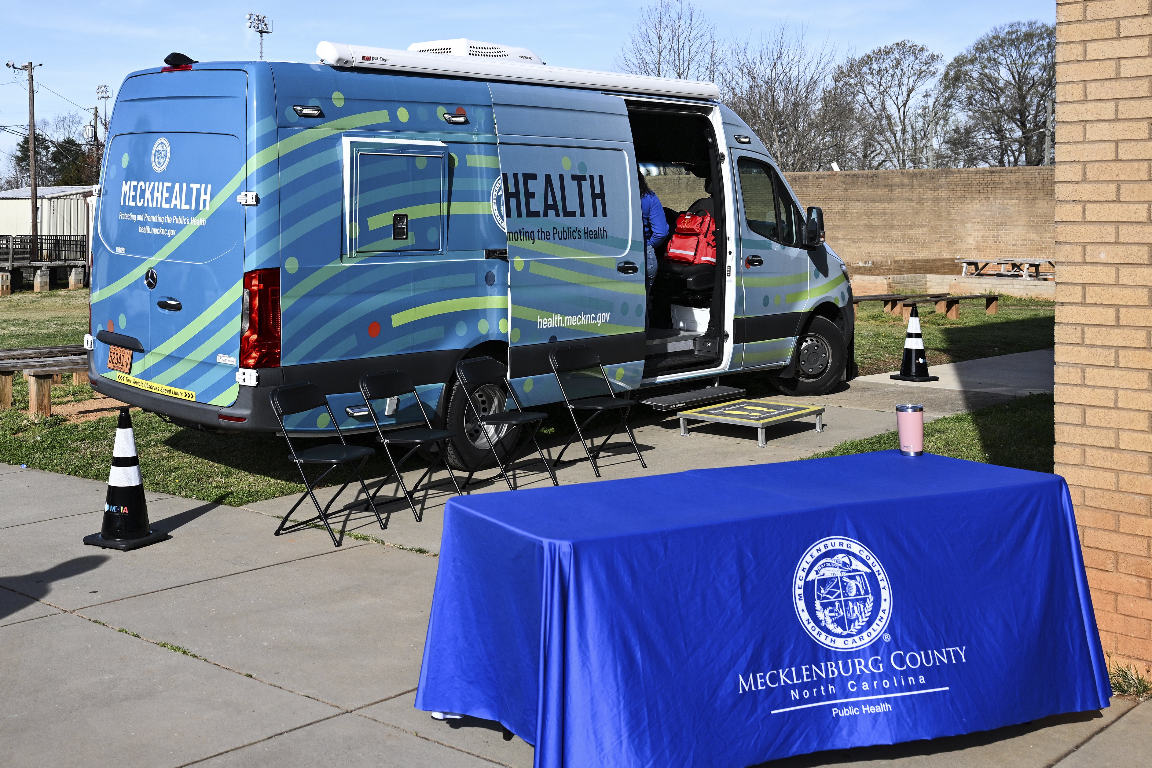 A mobile health unit is parked outside of Independence High School in Charlotte, N.C., on Wednesday, March 19, 2025. (AP Photo/Matt Kelley)