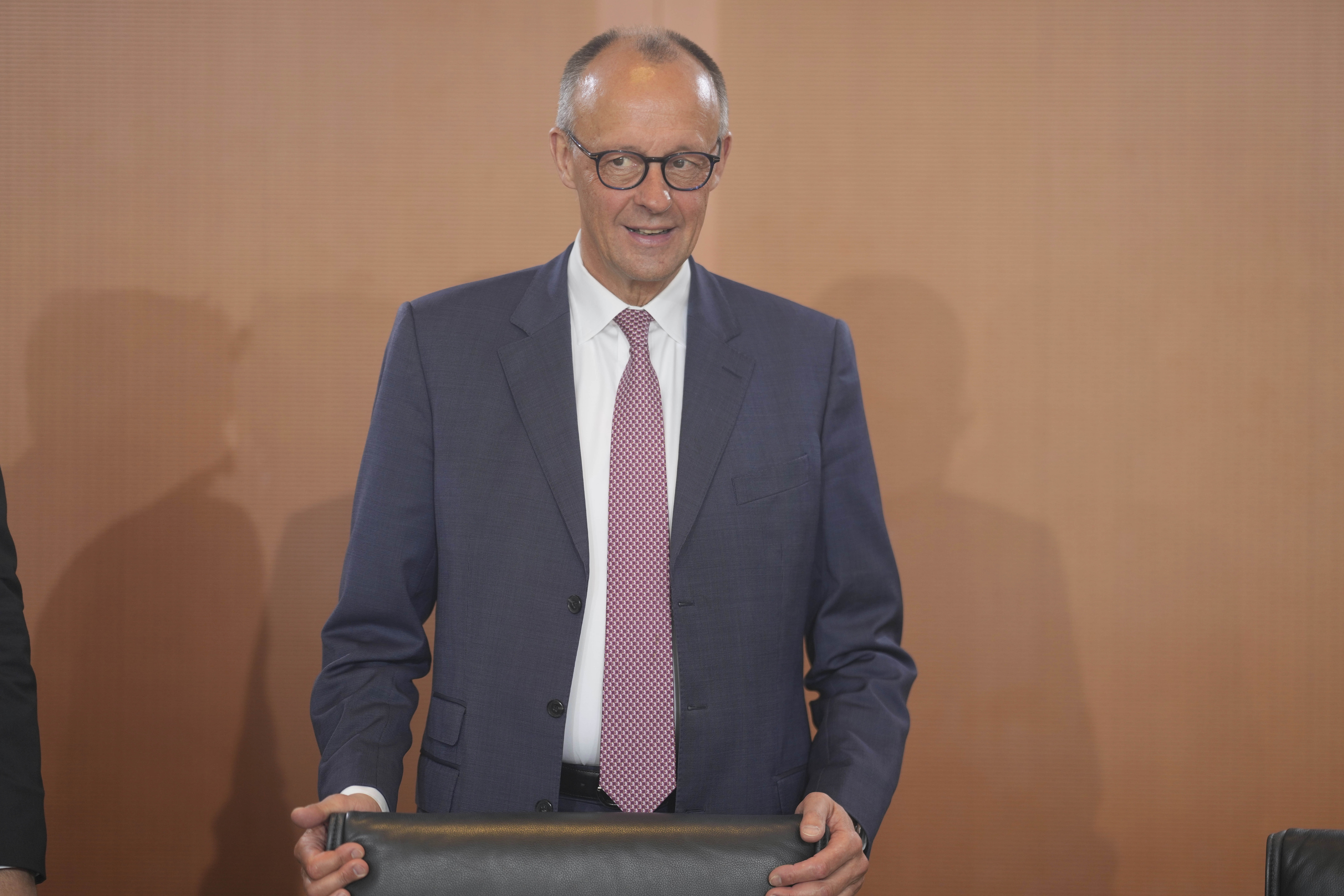 German Chancellor Friedrich Merz arrives for the cabinet meeting at the chancellery in Berlin, Germany, Wednesday, May 28, 2025. (AP Photo/Markus Schreiber)