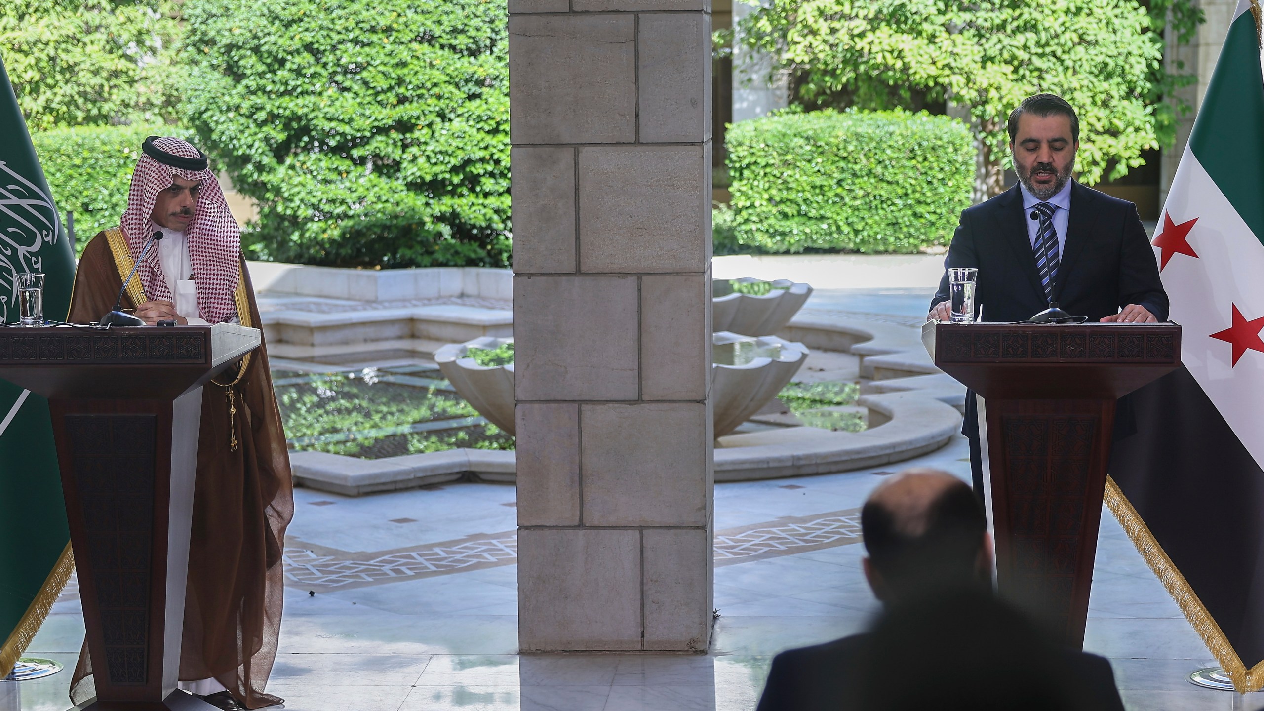 Syrian Foreign Minister Asaad al-Shibani, right, speaks during a joint press conference with his Saudi counterpart Prince Faisal bin Farhan, in Damascus, Syria, Saturday, May 31, 2025. (AP Photo/Ghaith Alsayed)