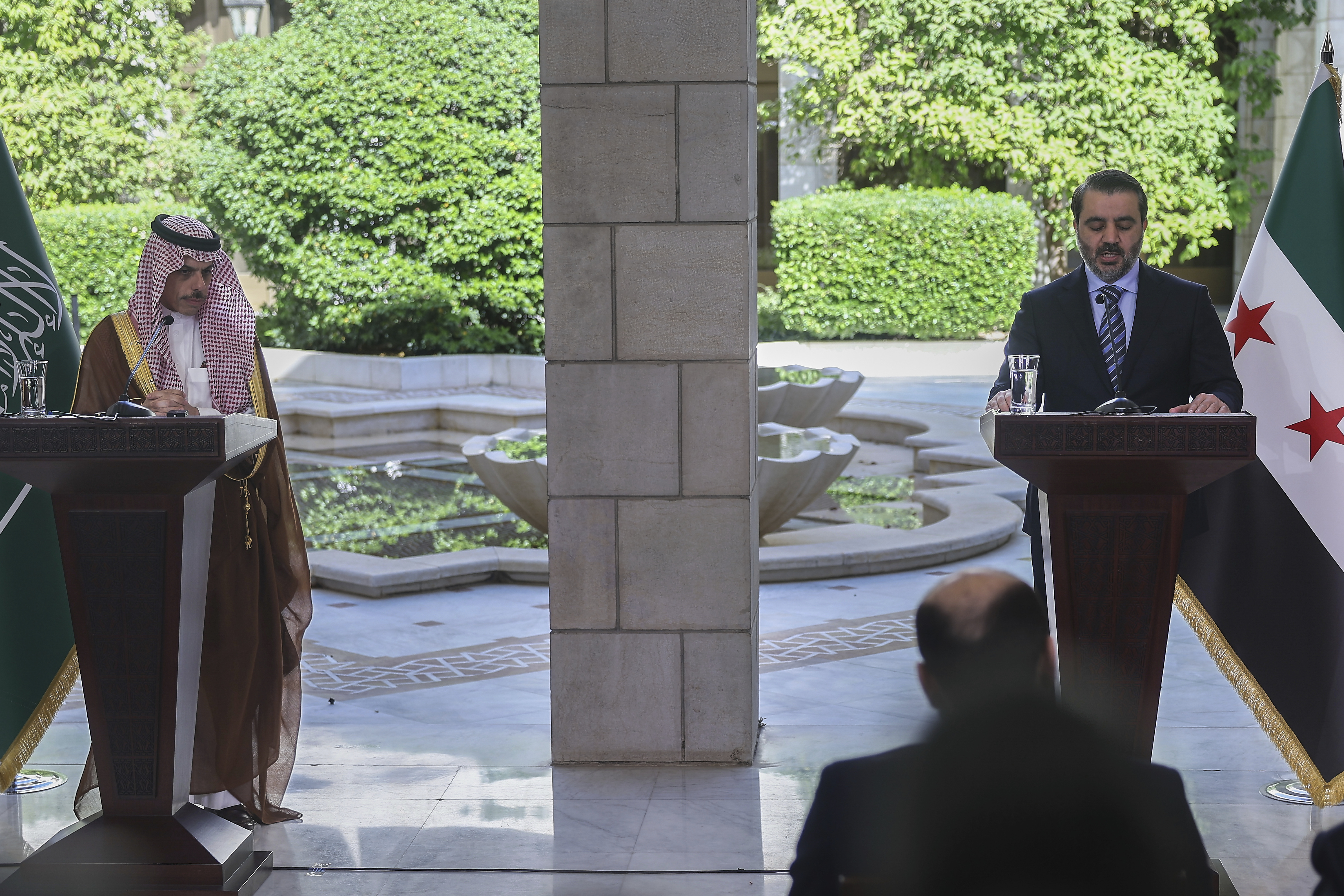 Syrian Foreign Minister Asaad al-Shibani, right, speaks during a joint press conference with his Saudi counterpart Prince Faisal bin Farhan, in Damascus, Syria, Saturday, May 31, 2025. (AP Photo/Ghaith Alsayed)
