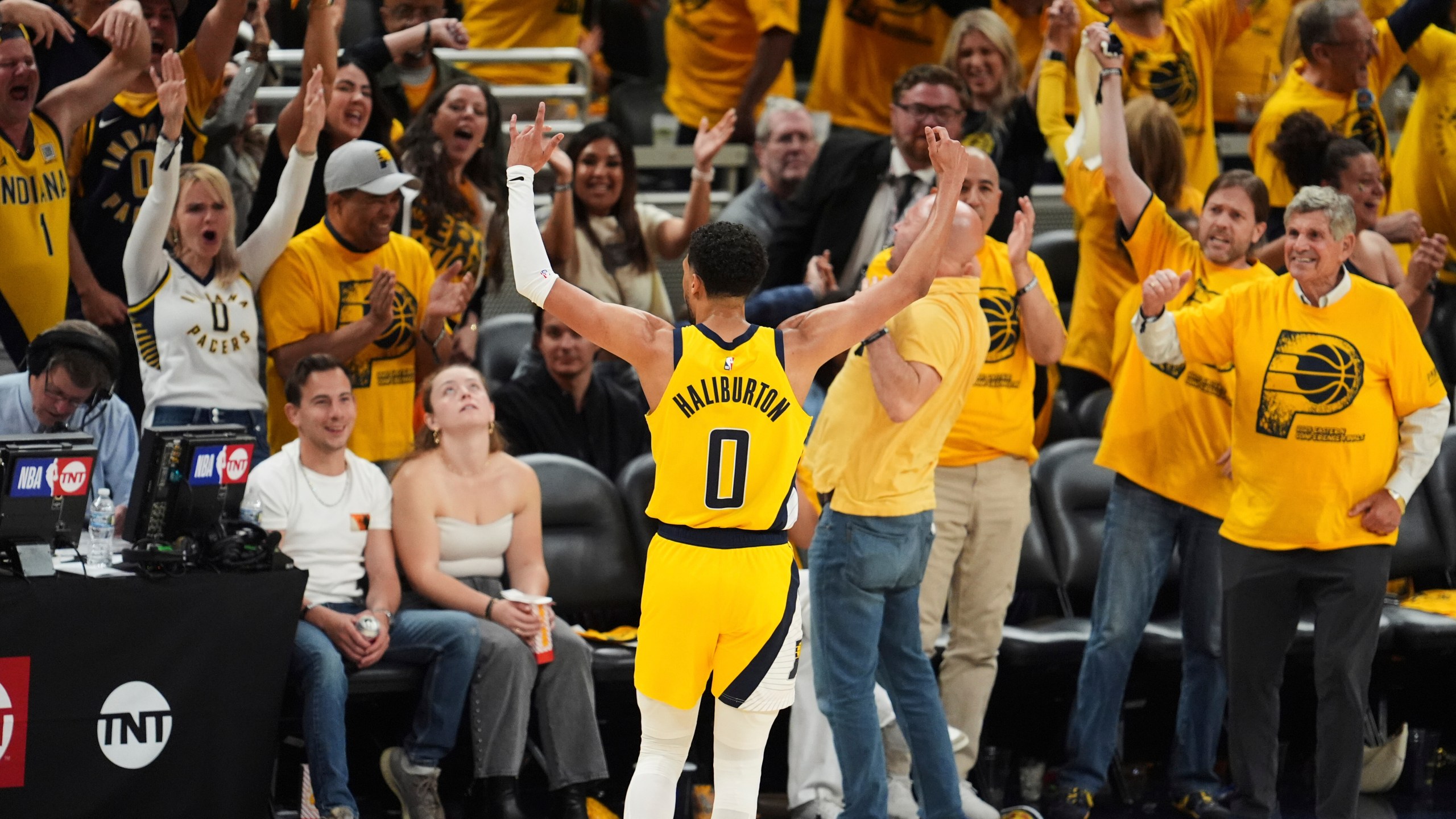 Indiana Pacers guard Tyrese Haliburton celebrates after a teammate made a 3-pointer during the second half of Game 6 of the Eastern Conference finals of the NBA basketball playoffs against the New York Knicks in Indianapolis, Saturday, May 31, 2025. (AP Photo/Michael Conroy)