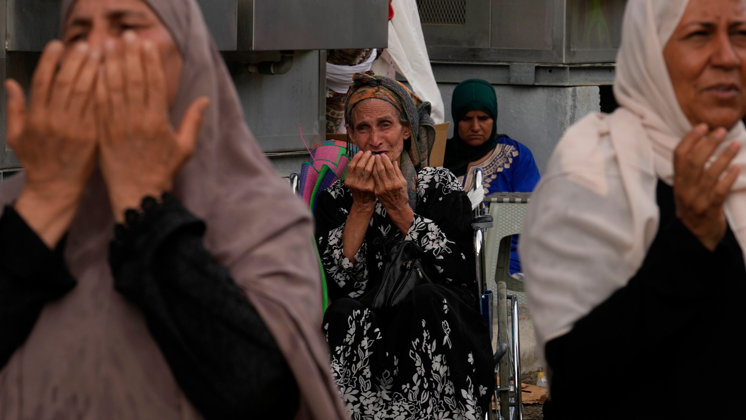 FILE - Muslim pilgrims pray after casting stones at pillars in the symbolic stoning of the devil during the annual hajj, as it rains in Mina, near the holy city of Mecca, Saudi Arabia, Monday, June 17, 2024. (AP Photo/Rafiq Maqbool, File)