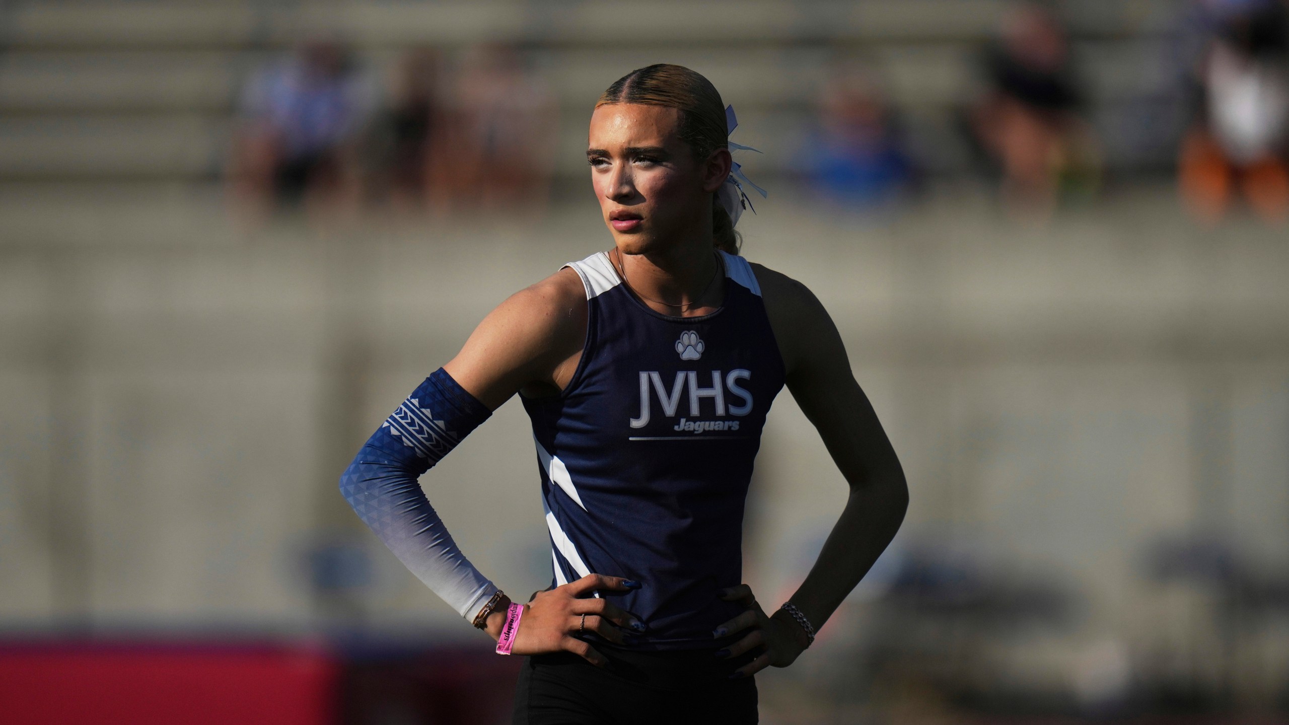 AB Hernandez, a transgender student at Jurupa Valley High School, stands on the field during the California high school track-and-field championships in Clovis, Calif., Saturday, May 31, 2025. (AP Photo/Jae C. Hong)