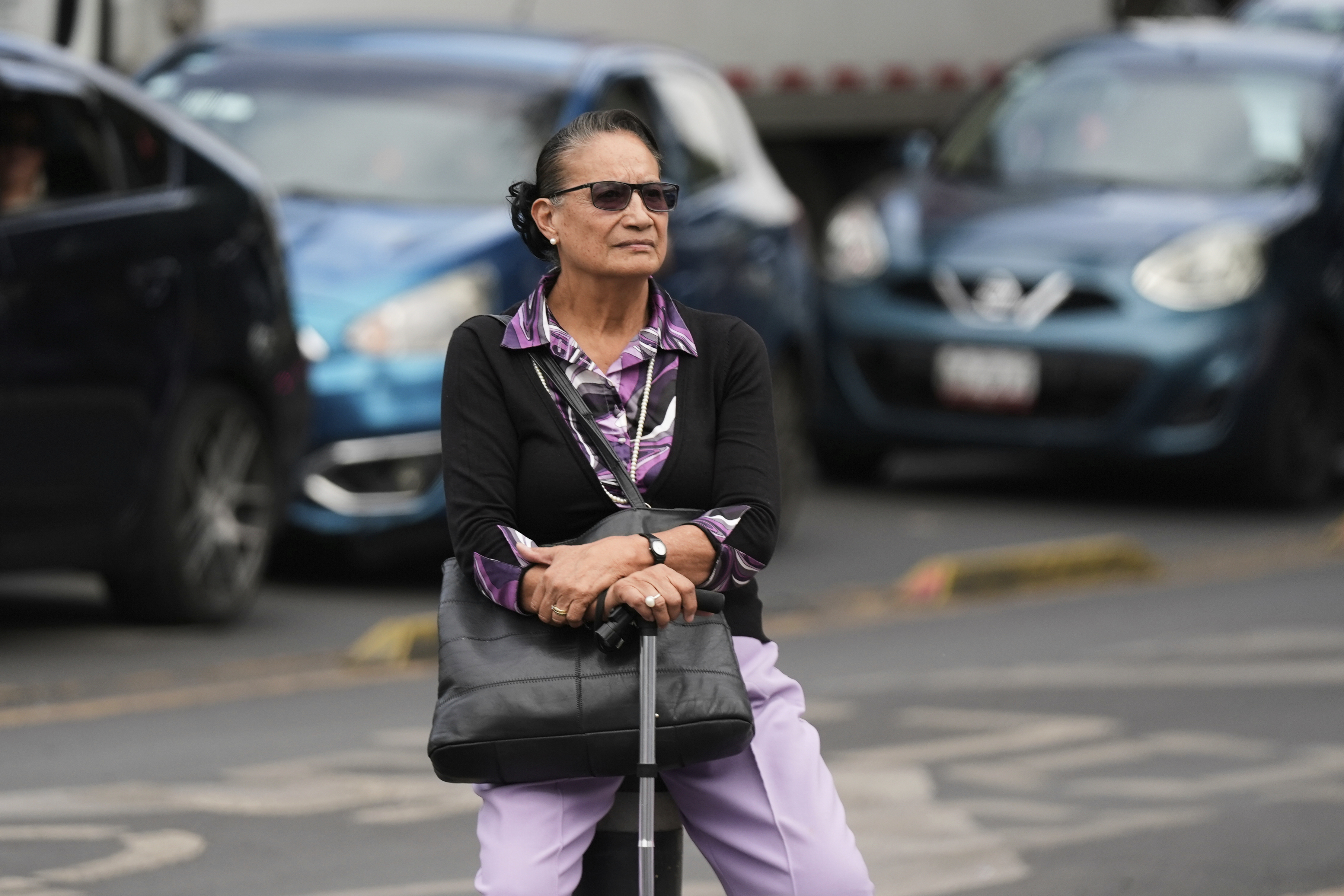 Socorro Rivera sits at a square where Lenia Batres, who is running for election for the Mexican Supreme Court, delivers a speech at her closing campaign rally in Mexico City, Wednesday, May 28, 2025. (AP Photo/Fernando Llano)