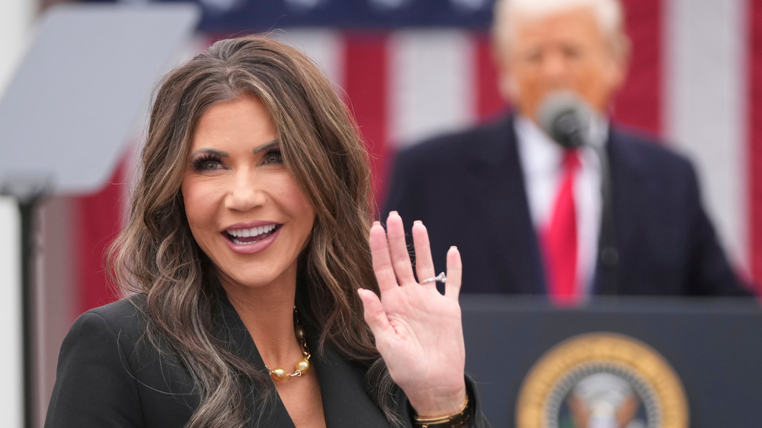 FILE - Homeland Security Secretary Kristi Noem is recognized as President Donald Trump speaks during an event to announce new tariffs in the Rose Garden at the White House, April 2, 2025, in Washington. (AP Photo/Mark Schiefelbein, File)