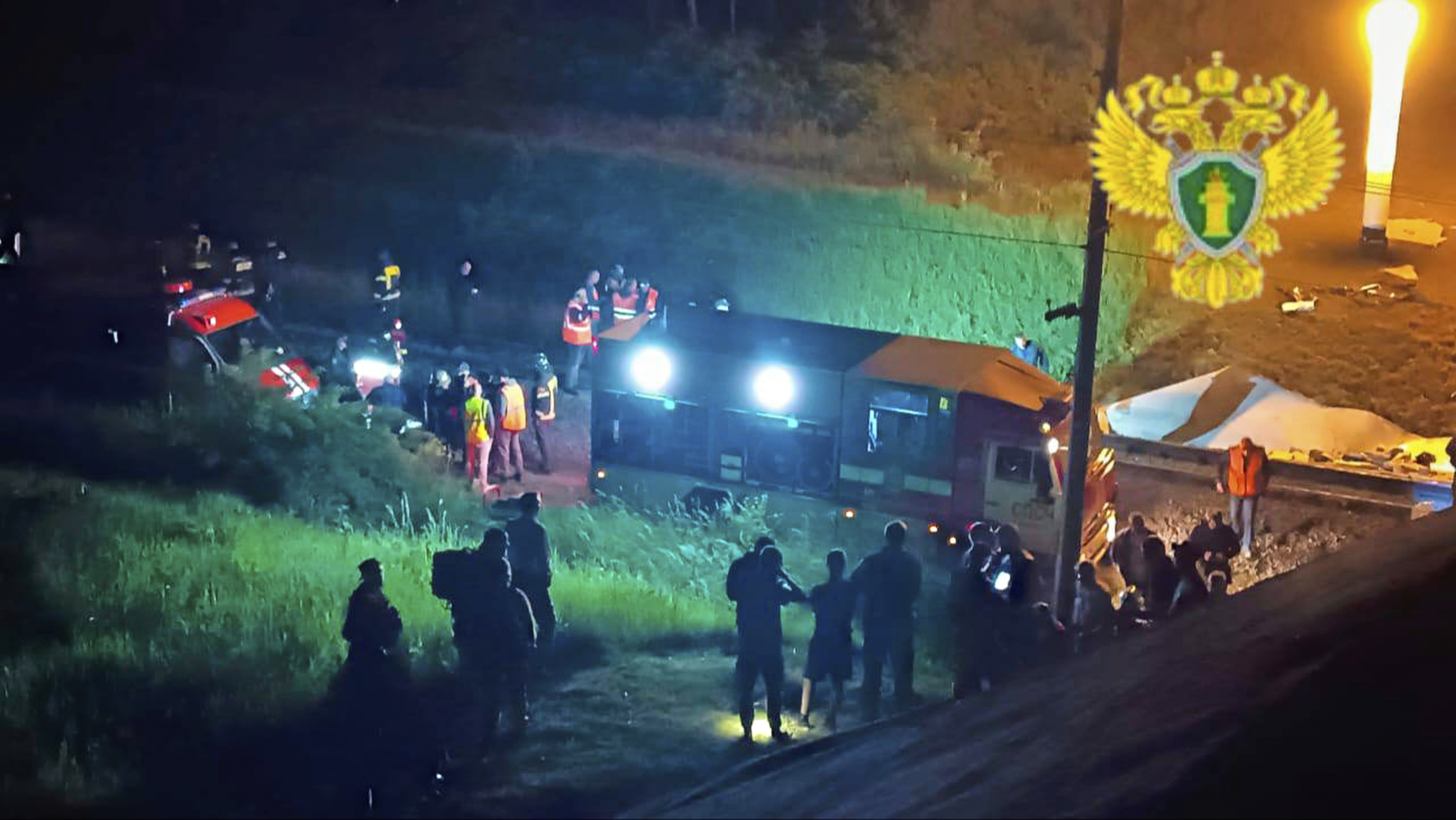 In this photo released by Moscow Interregional Transport Prosecutor's Office telegram channel on Sunday, June 1, 2025, emergency employees work at a damaged bridge in Russia's Bryansk region, which borders Ukraine. (Moscow Interregional Transport Prosecutor's Office telegram channel via AP)