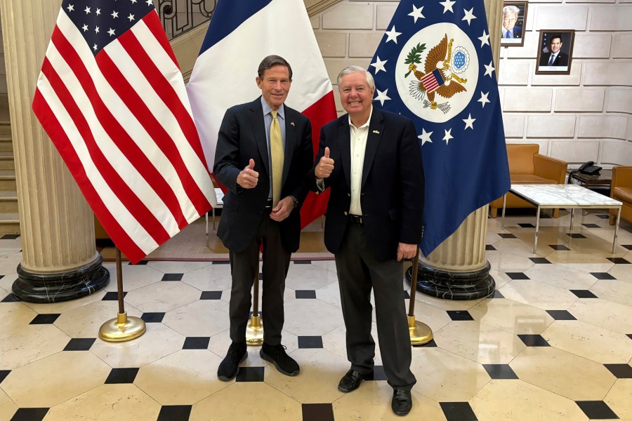 Sen. Richard Blumenthal, D-Conn., left, and Sen. Lindsey Graham, R-S.C thumb up during a news event at the US embassy to France, Sunday, June 1, 2025 in Paris. (AP Photo/Thomas Adamson)
