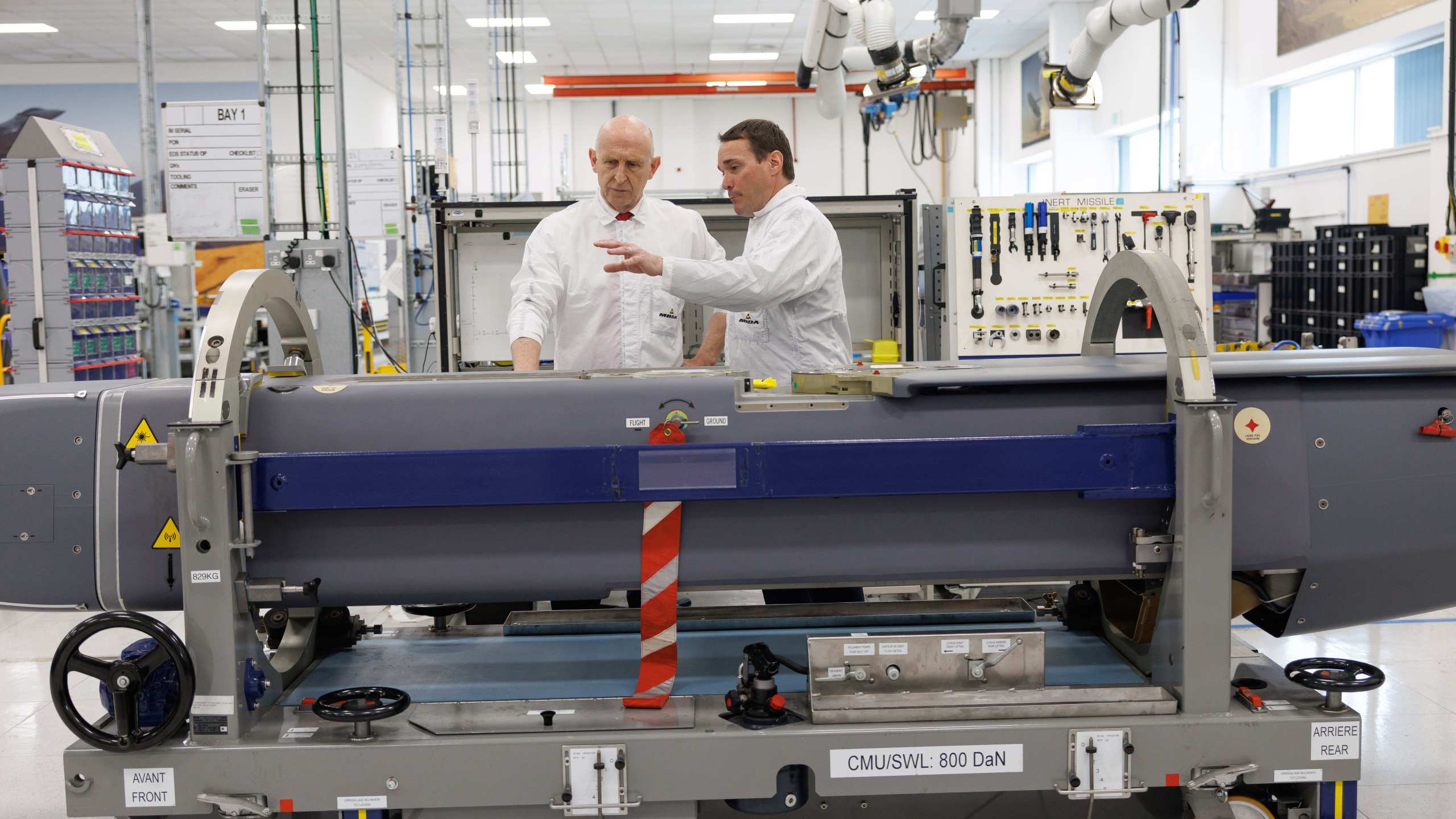Director of Mechanical Engineering Matt Beamont shows Britain's Defence Secretary John Healey, left, a storm shadow missile on an assembly line at the MBDA Storm Shadow factory in Stevenage, England, Saturday May 31, 2025. (Dan Kitwood/Pool via AP)