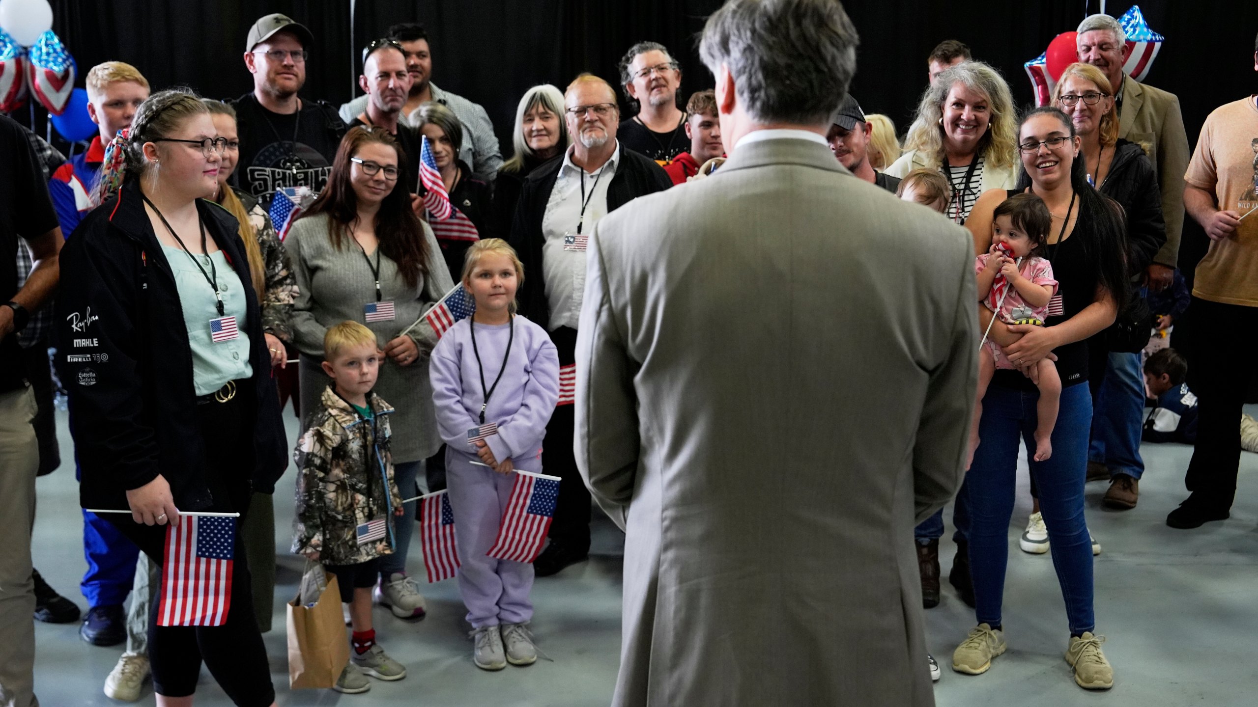 FILE - Deputy Secretary of State Christopher Landau greets Afrikaner refugees from South Africa, May 12, 2025, at Dulles International Airport in Dulles, Va. (AP Photo/Julia Demaree Nikhinson, file)