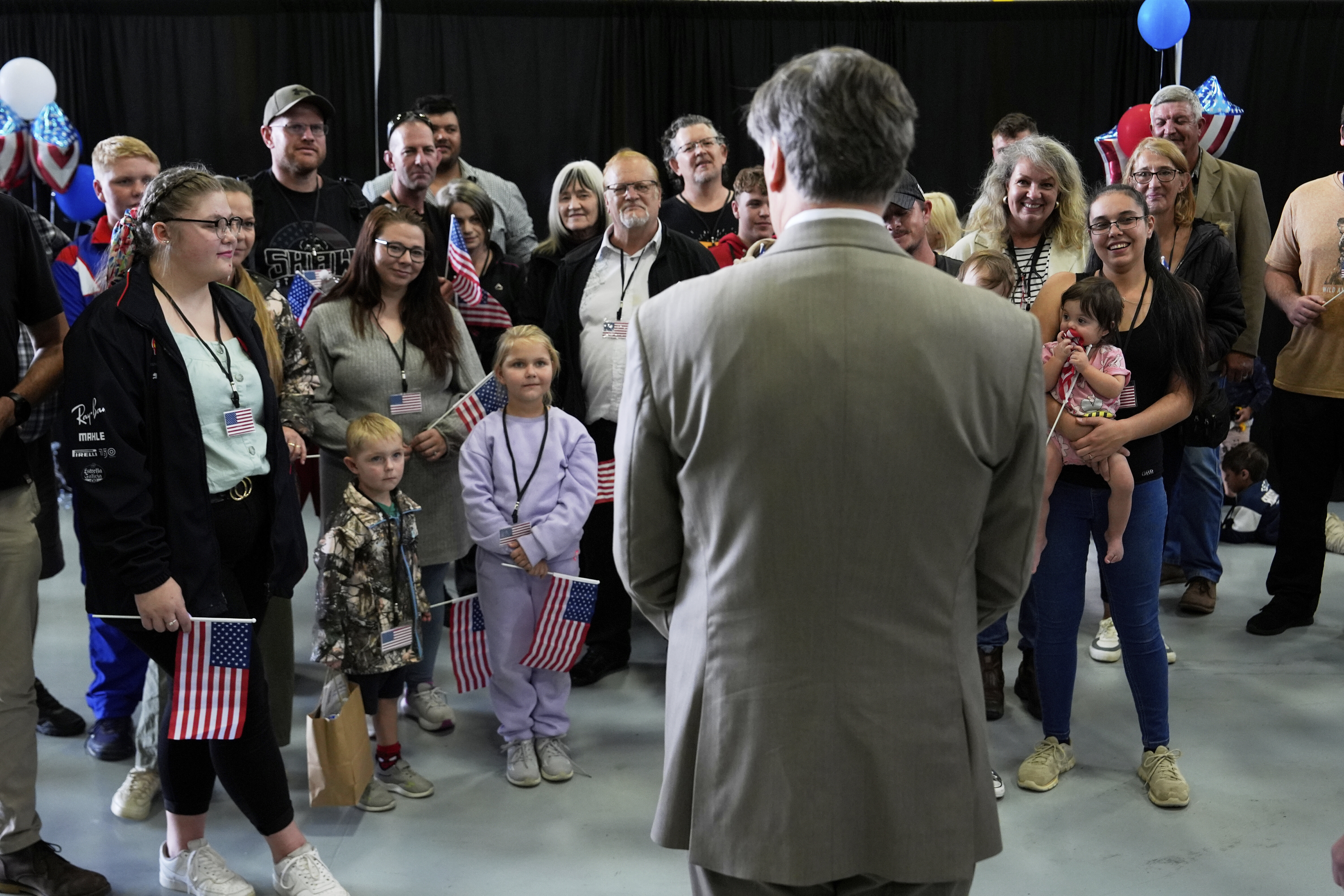 FILE - Deputy Secretary of State Christopher Landau greets Afrikaner refugees from South Africa, May 12, 2025, at Dulles International Airport in Dulles, Va. (AP Photo/Julia Demaree Nikhinson, file)