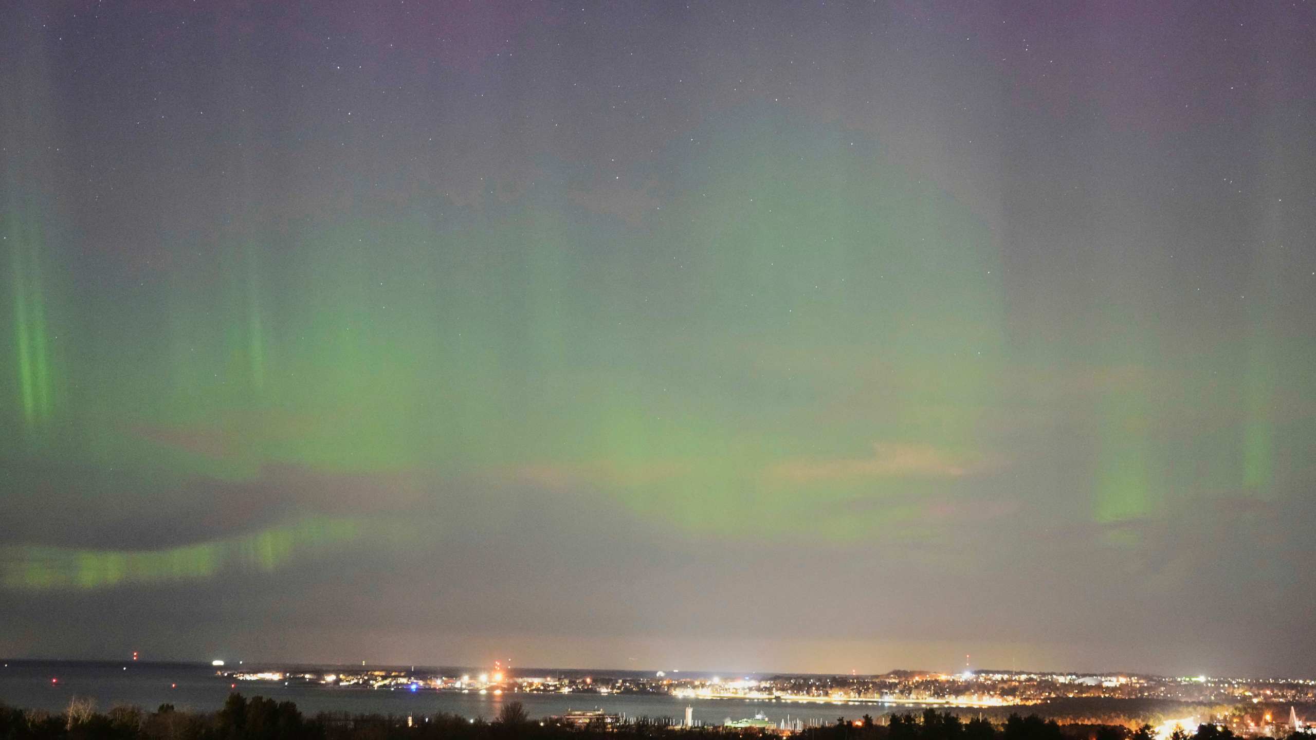FILE - An aurora borealis, also known as the northern lights, is seen in the night sky over the Tallinn bay of the Baltic sea in Tallinn, Estonia, April 2, 2025. (AP Photo/Sergei Grits, file)