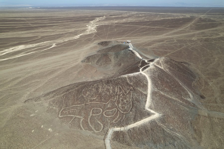 FILE - A cat-like Nazca Line geoglyph is visible from above in Nazca, Peru, May 17, 2023. (AP Photo/Martin Mejia, File)