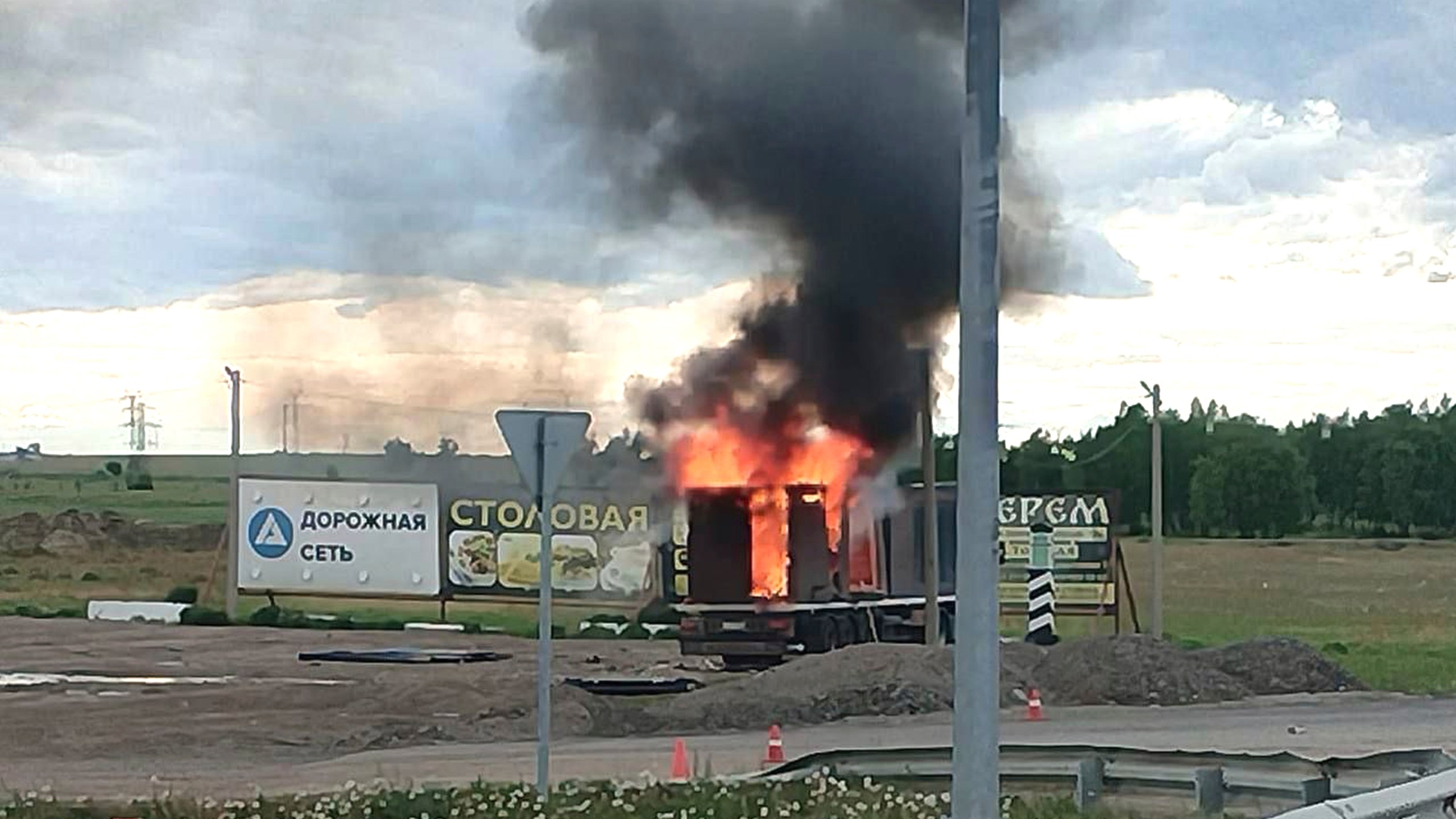 This photo released by Governor of Irkutsk region Igor Kobzev telegram channel on Sunday, June 1, 2025, shows a truck apparently used to release Ukrainian drones seen burning in the Irkutsk region, more than 4,000 kilometers (2,500 miles) from Ukraine. (Governor of Irkutsk region Igor Kobzev telegram channel via AP)