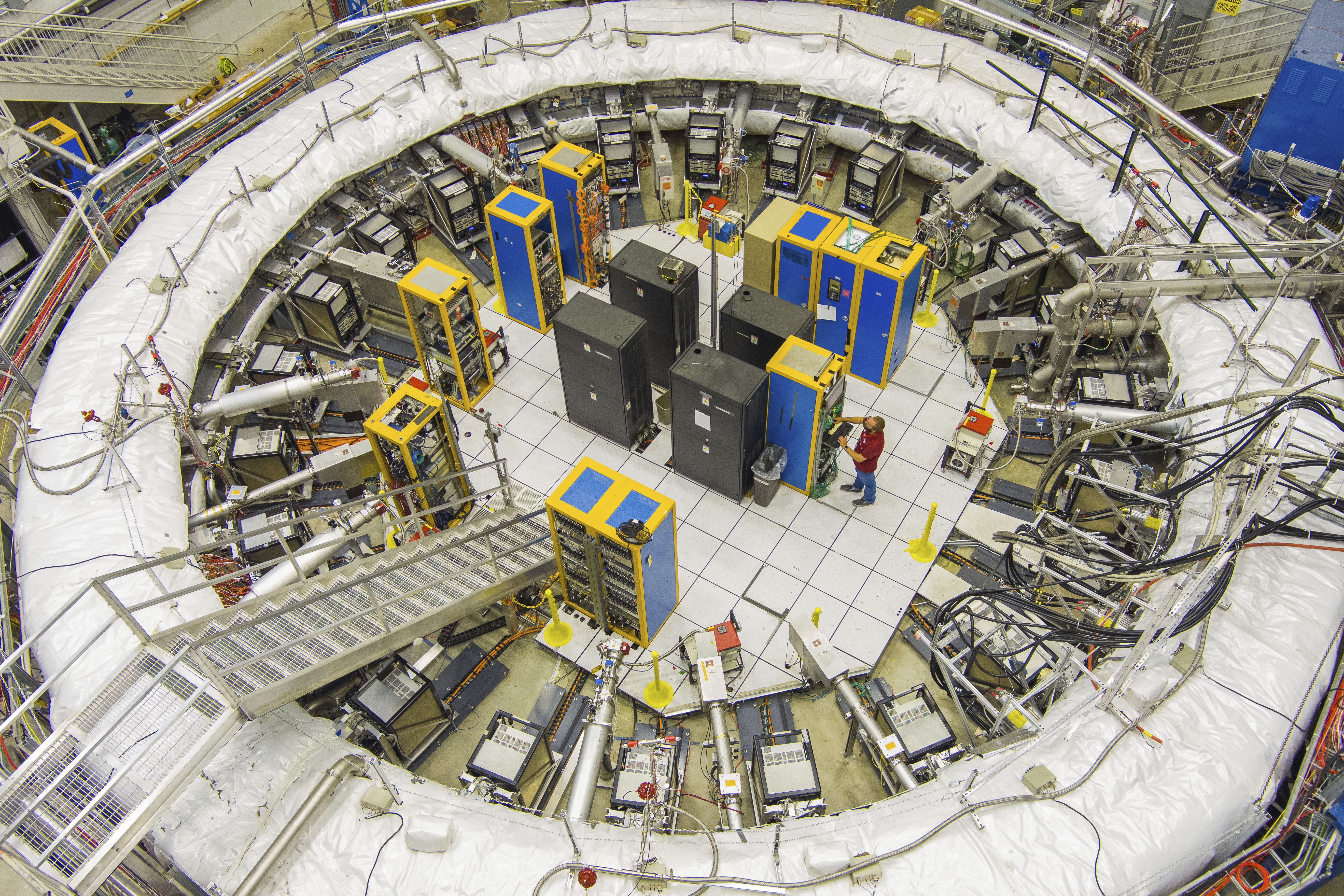 This image provided by the Fermi National Accelerator Laboratory shows the ring-shaped track that scientists used to study tiny particles called muons, July 20, 2023 in Batavia, Ill. (Ryan Posteland/Fermi National Accelerator Laboratory via AP)