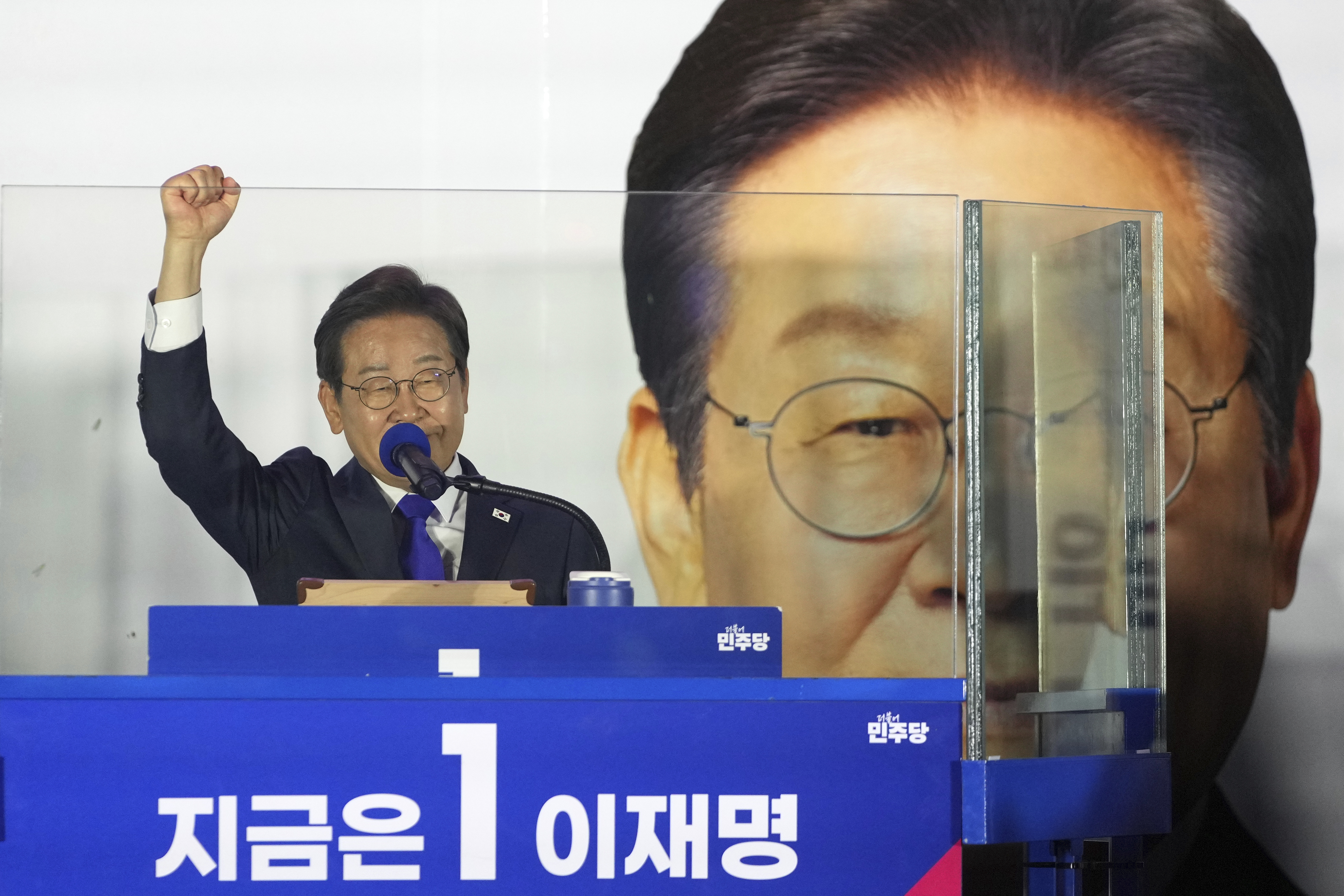 South Korea's Democratic Party's presidential candidate Lee Jae-myung, gestures as he speaks to supporters outside of the National Assembly in Seoul, South Korea, Wednesday, June 4, 2025. (AP Photo/Lee Jin-man)