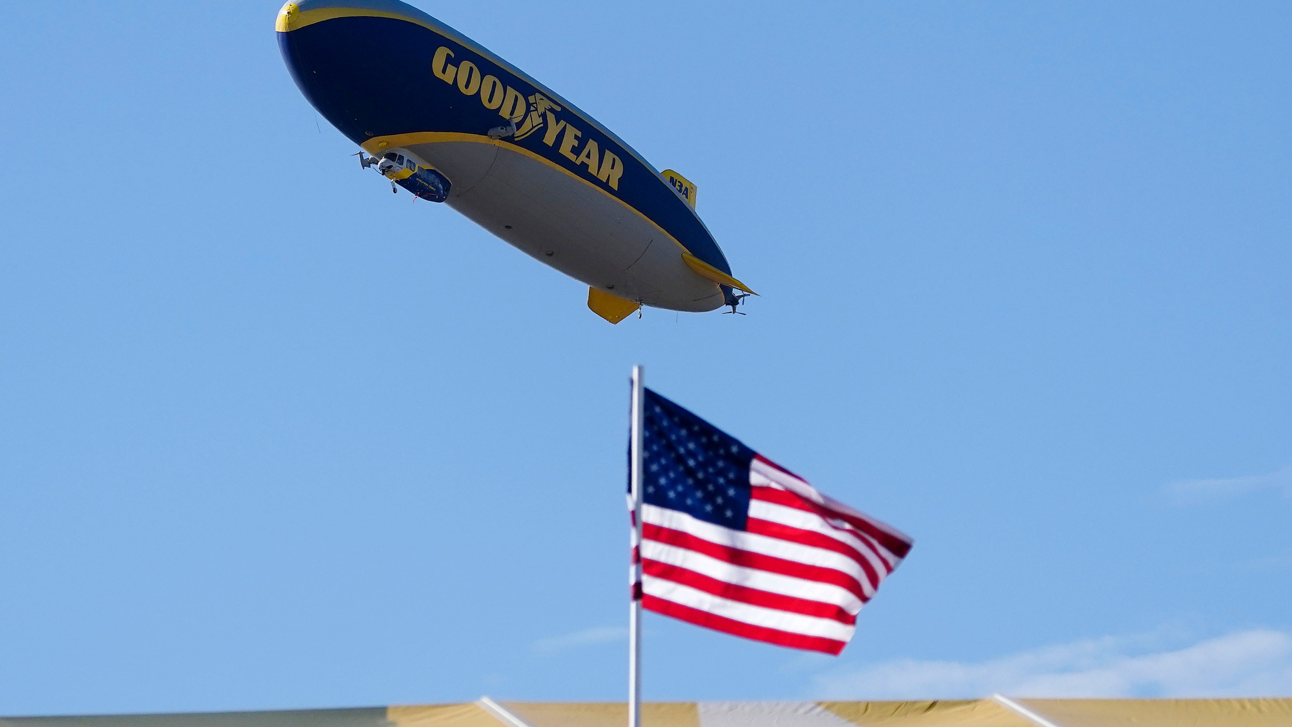 FILE - The Goodyear blimp hovers above the 16th hole during the Phoenix Open golf tournament, Sunday, Feb. 12, 2023, in Scottsdale, Ariz. (AP Photo/Darryl Webb, File)
