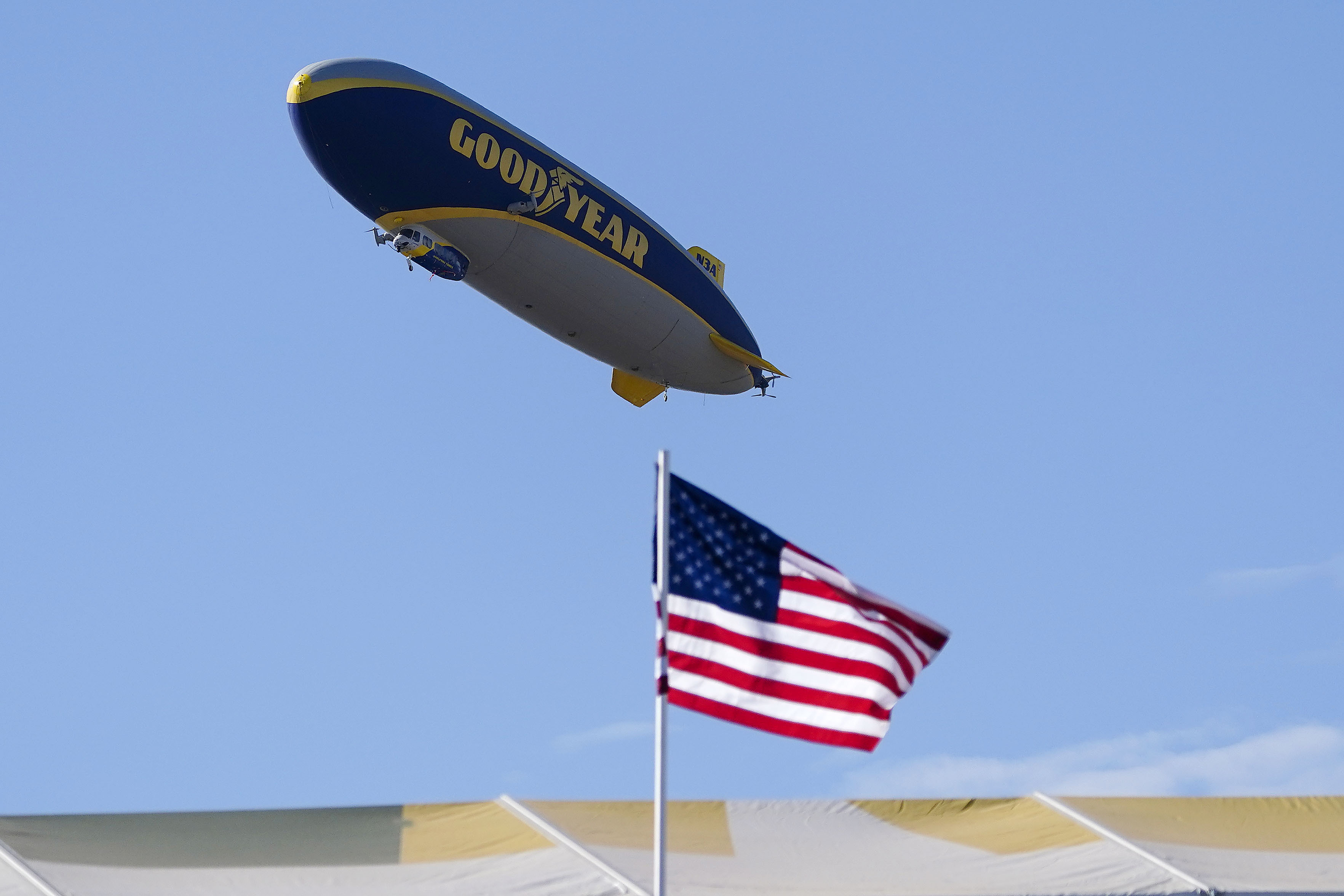 FILE - The Goodyear blimp hovers above the 16th hole during the Phoenix Open golf tournament, Sunday, Feb. 12, 2023, in Scottsdale, Ariz. (AP Photo/Darryl Webb, File)