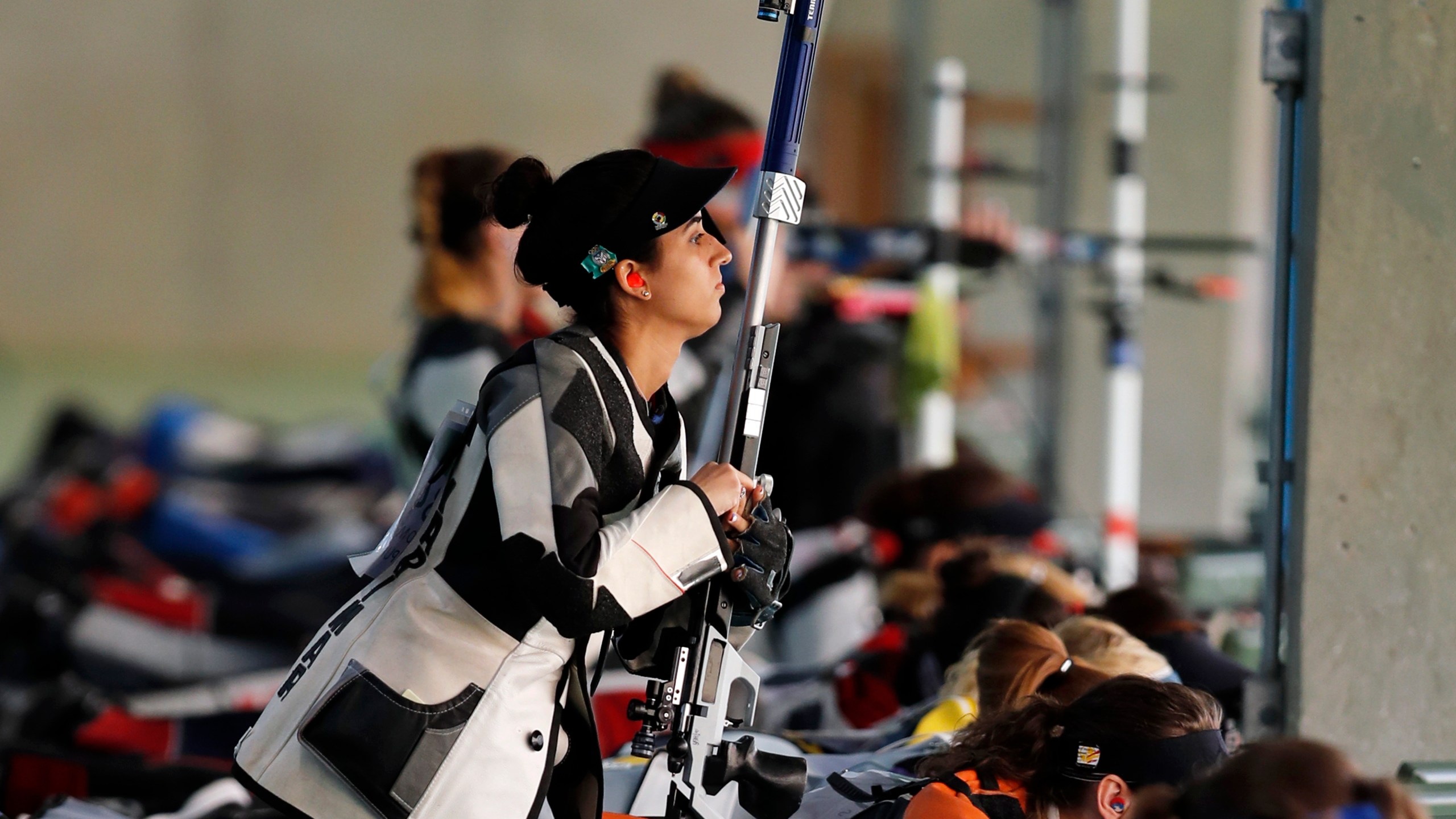 FILE - Yarimar Mercado Martinez, of Puerto Rico, competes during the women's 50-meter Rifle 3 Positions qualification, at the Olympic Shooting Center, during the 2016 Summer Olympics in Rio de Janeiro, Brazil on Aug. 11, 2016. (AP Photo/Hassan Ammar, File)