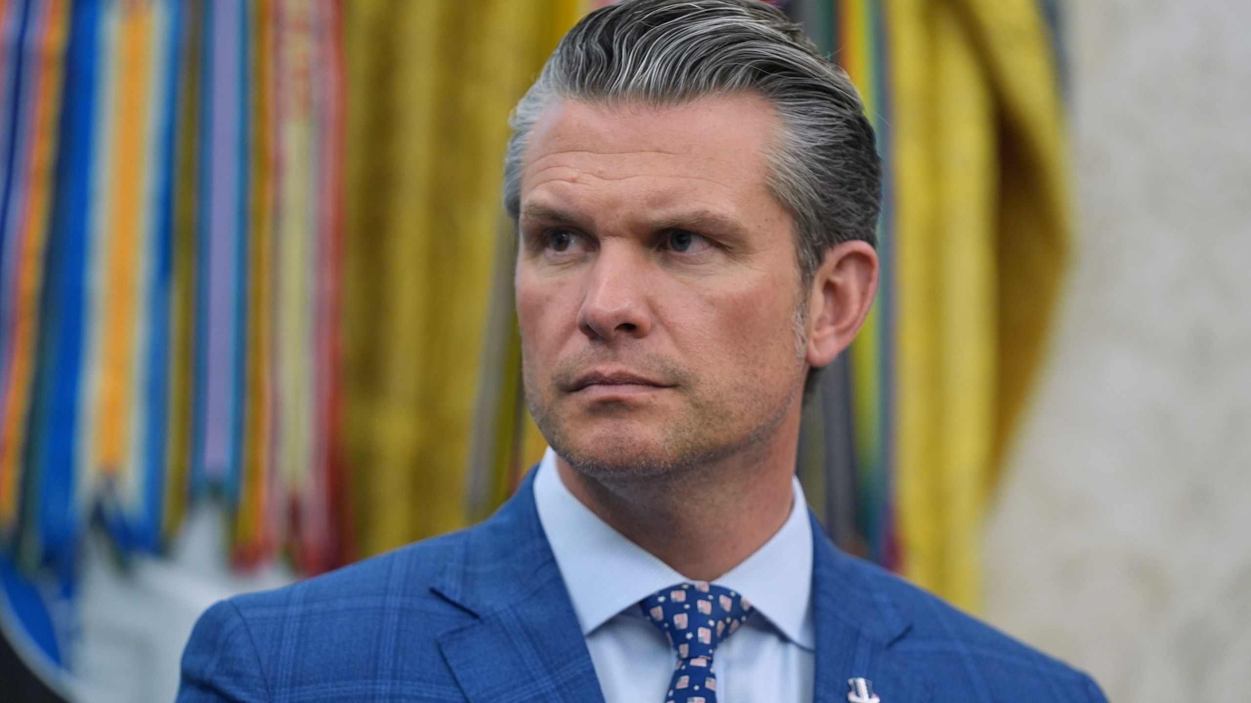 Defense Secretary Pete Hegseth listens during an event with President Donald Trump to sign executive orders regarding nuclear energy in the Oval Office of the White House, Friday, May 23, 2025, in Washington. (AP Photo/Evan Vucci)