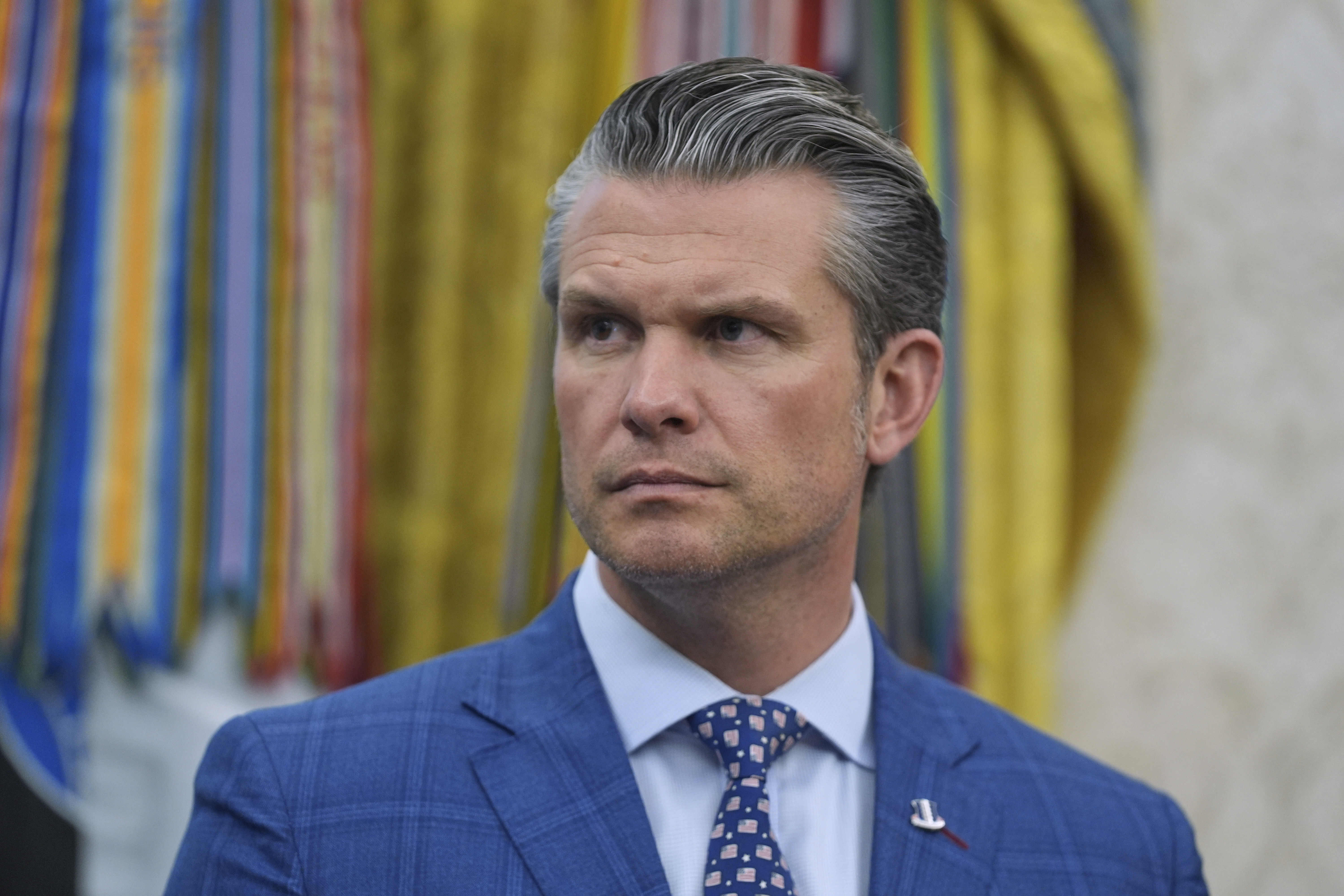 Defense Secretary Pete Hegseth listens during an event with President Donald Trump to sign executive orders regarding nuclear energy in the Oval Office of the White House, Friday, May 23, 2025, in Washington. (AP Photo/Evan Vucci)