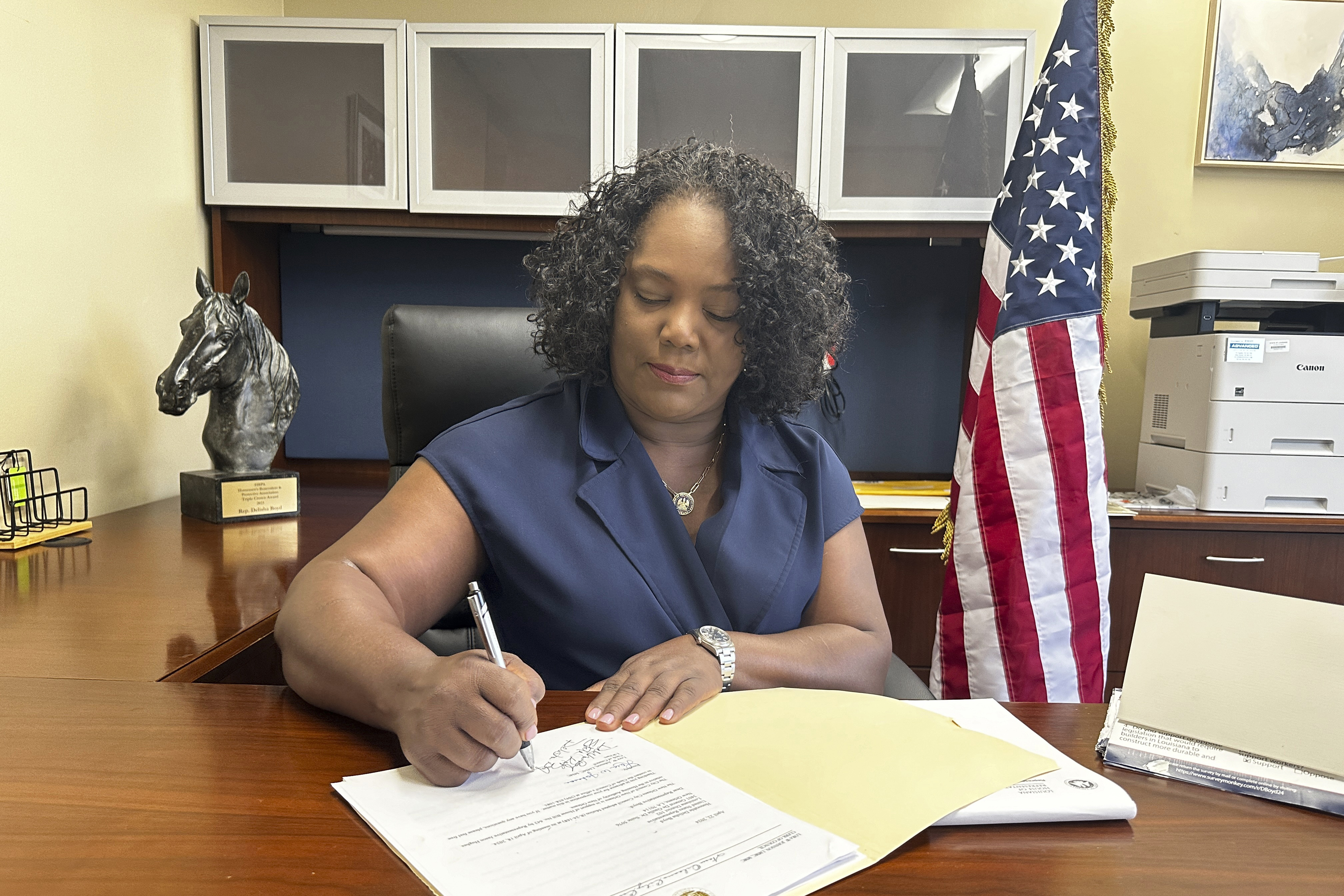 FILE - Louisiana Democratic state Rep. Delisha Boyd works at her desk at her office May 3, 2024, in New Orleans. (AP Photo/Stephen Smith, file)