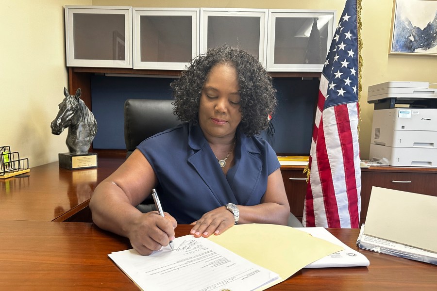 FILE - Louisiana Democratic state Rep. Delisha Boyd works at her desk at her office May 3, 2024, in New Orleans. (AP Photo/Stephen Smith, file)
