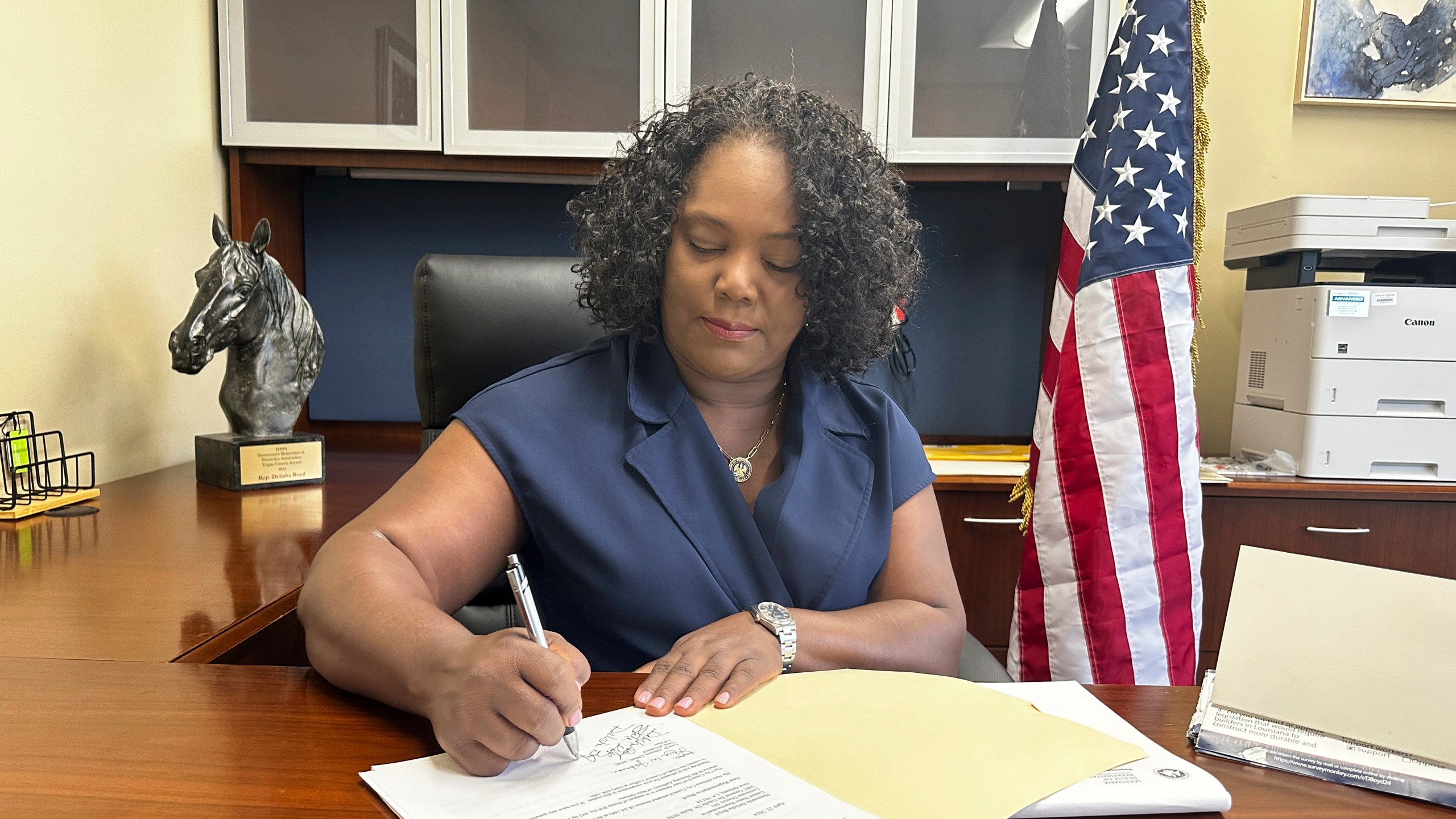 FILE - Louisiana Democratic state Rep. Delisha Boyd works at her desk at her office May 3, 2024, in New Orleans. (AP Photo/Stephen Smith, file)