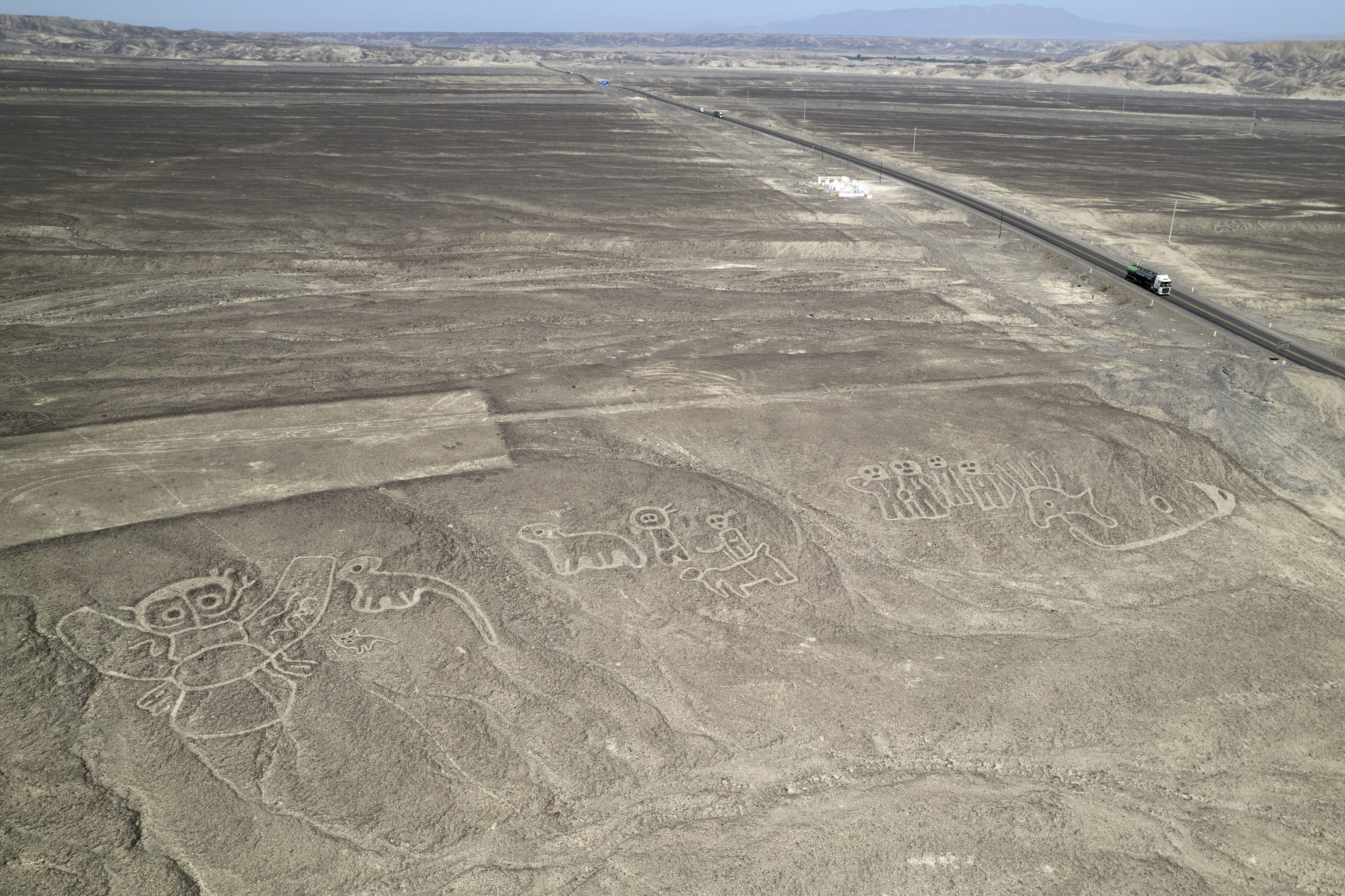 FILE - Geoglyphs known as the Nazca Lines are visible next to the Pan American Highway in La Pampa de Nazca, Peru, May 17, 2023. (AP Photo/Martin Mejia, File)
