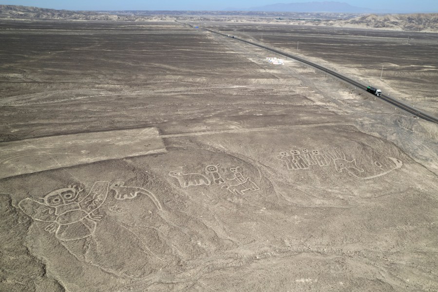FILE - Geoglyphs known as the Nazca Lines are visible next to the Pan American Highway in La Pampa de Nazca, Peru, May 17, 2023. (AP Photo/Martin Mejia, File)