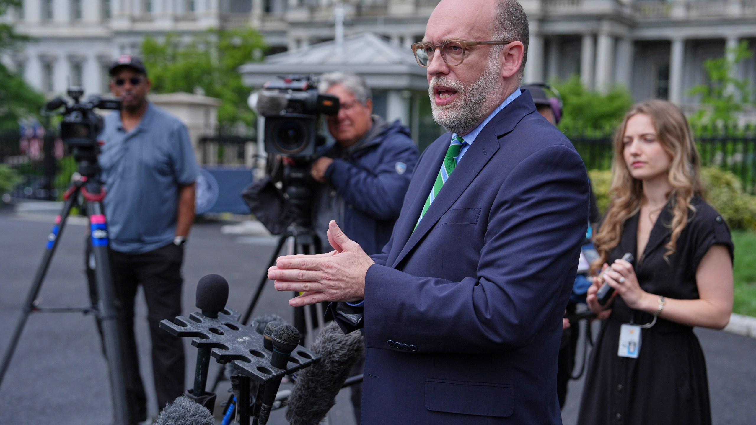 Office of Management and Budget director Russell Vought speaks to reporters at the White House, Thursday, May 22, 2025, in Washington. (AP Photo/Evan Vucci)