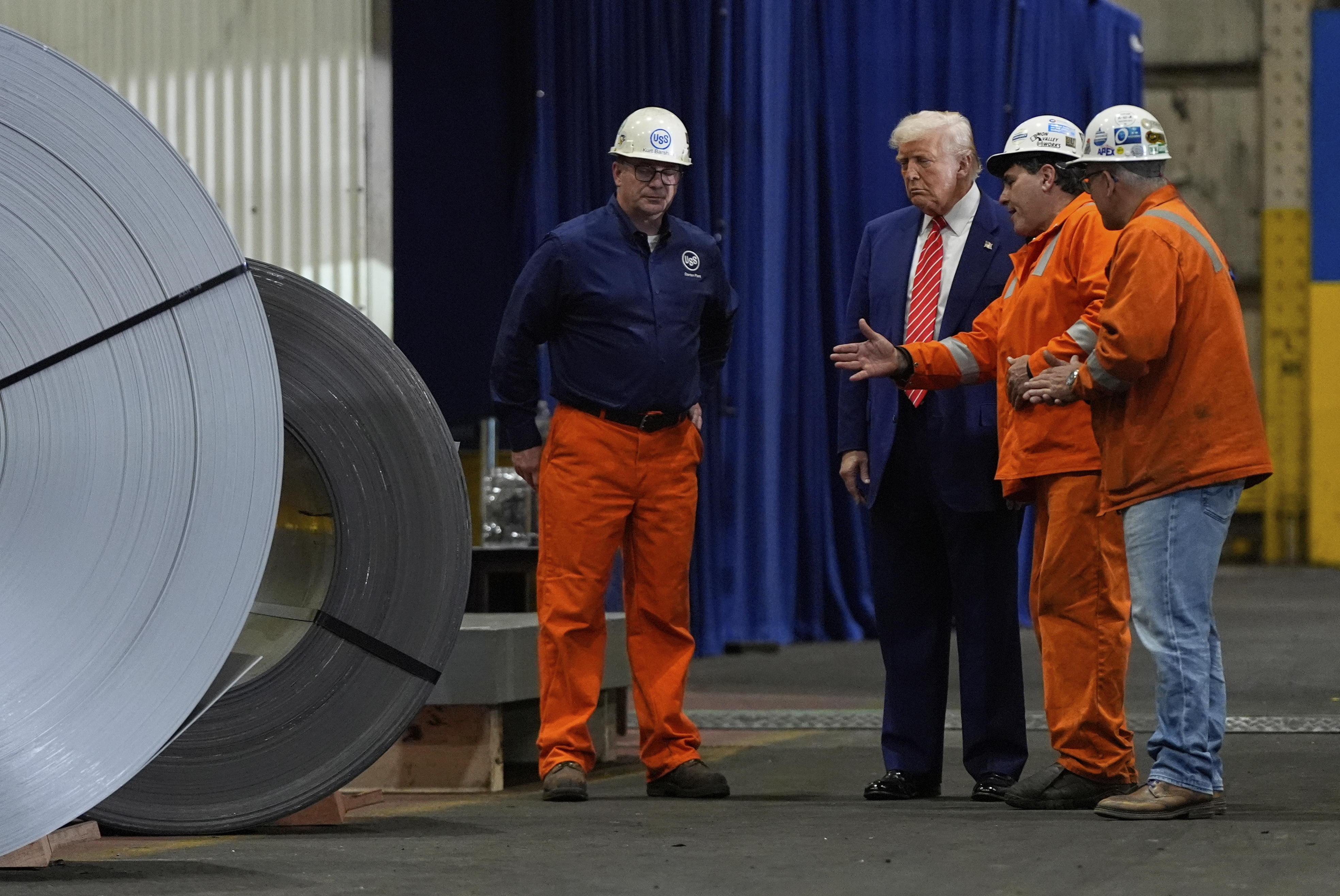 President Donald Trump talks to workers as he tours U.S. Steel Corporation's Mon Valley Works-Irvin plant, Friday, May 30, 2025, in West Mifflin, Pa. (AP Photo/Julia Demaree Nikhinson)