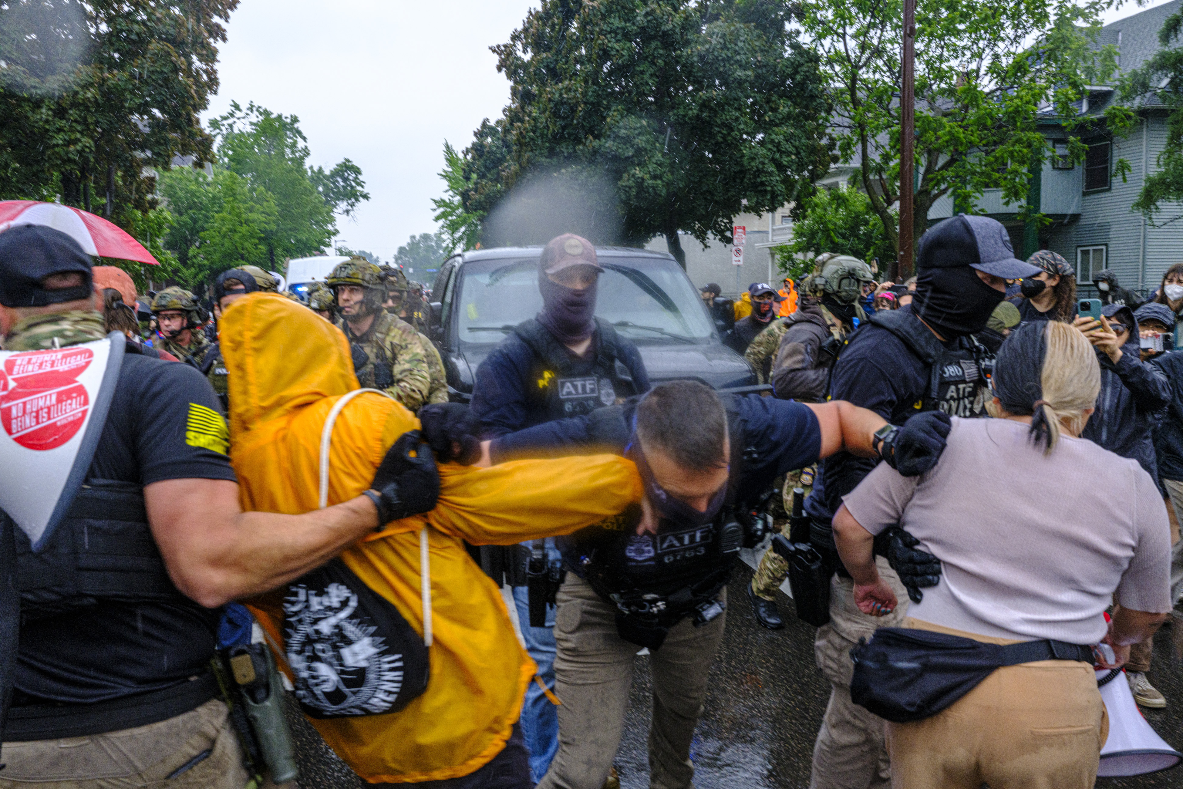 Protesters confront ICE, ATF, and FBI officers as federal agents conduct an operation in Minneapolis, on Tuesday, June 3, 2025. (Kerem Yücel/Minnesota Public Radio via AP)
