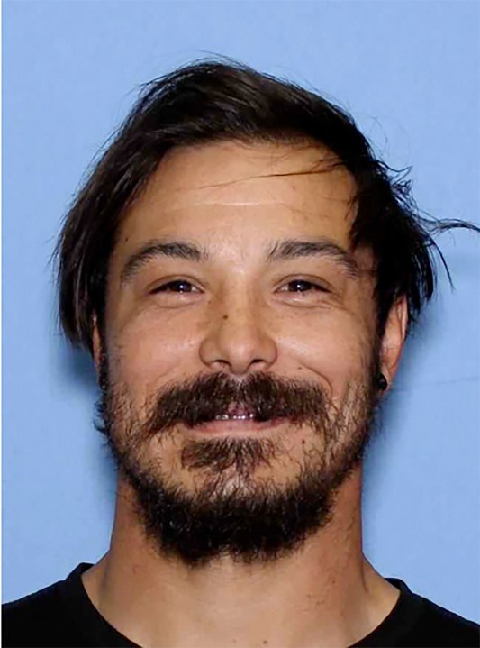 This undated photo provided by the Wenatchee Police Department shows Travis Caleb Decker who the police are asking the public for help in locating the Washington state father who is wanted for murder after his three young daughters were reported missing and then found dead. (Wenatchee Police Department via AP)