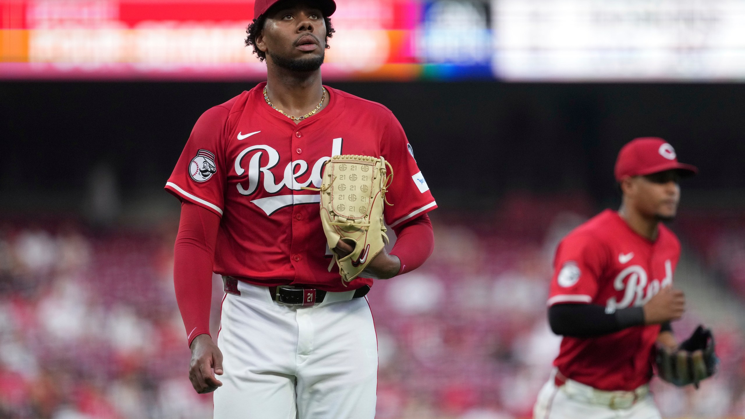 Cincinnati Reds' Hunter Greene walks to the dugout in the fifth inning of a baseball game against the Milwaukee Brewers, Tuesday, June 3, 2025, in Cincinnati. (AP Photo/Kareem Elgazzar)