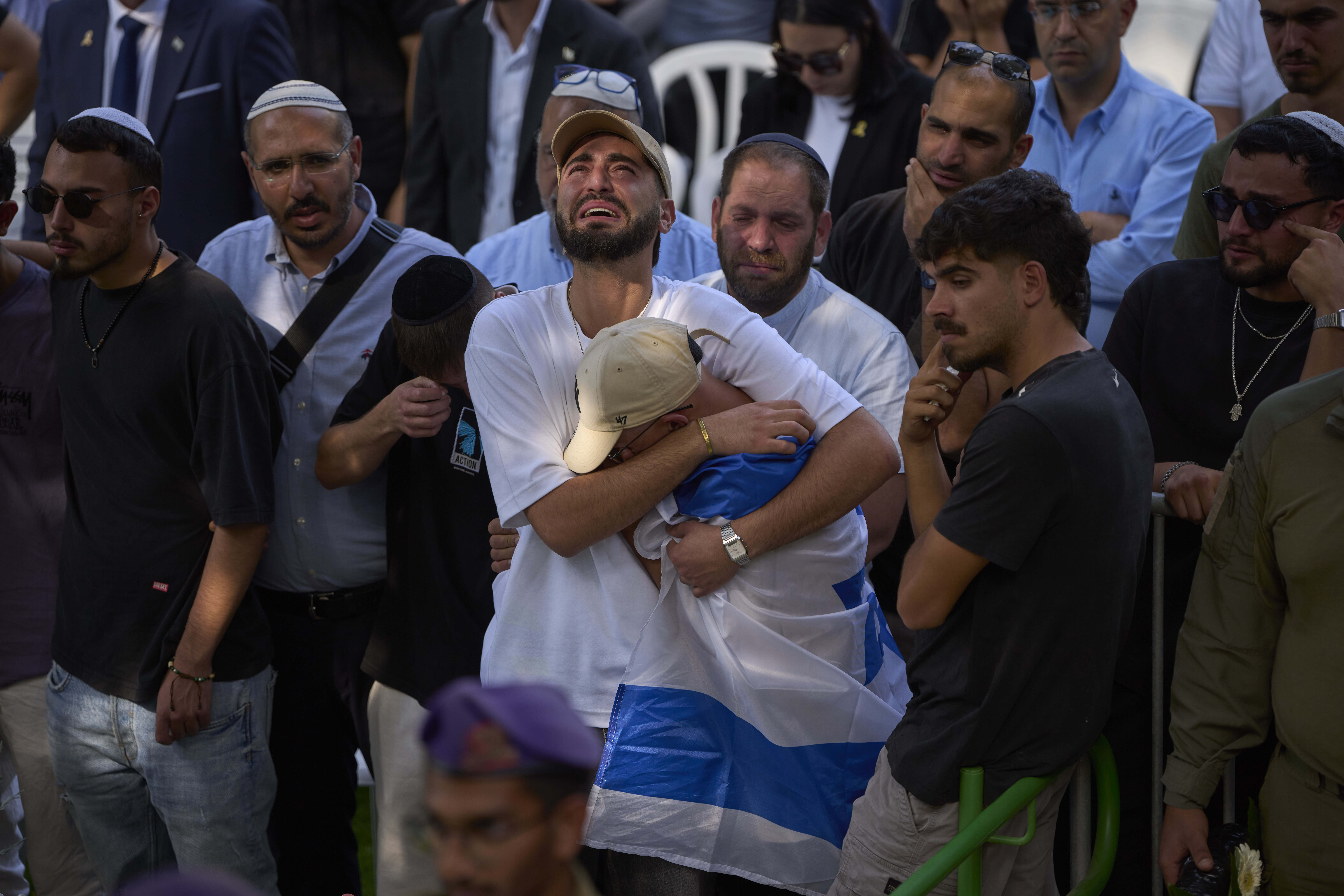 Mourners attend the funeral of Israeli soldier Sgt. Omer Van Gelder, who was killed in a battle in the Gaza Strip, at the Mount Herzl military cemetery in Jerusalem, Tuesday, June 3, 2025. (AP Photo/Ohad Zwigenberg)