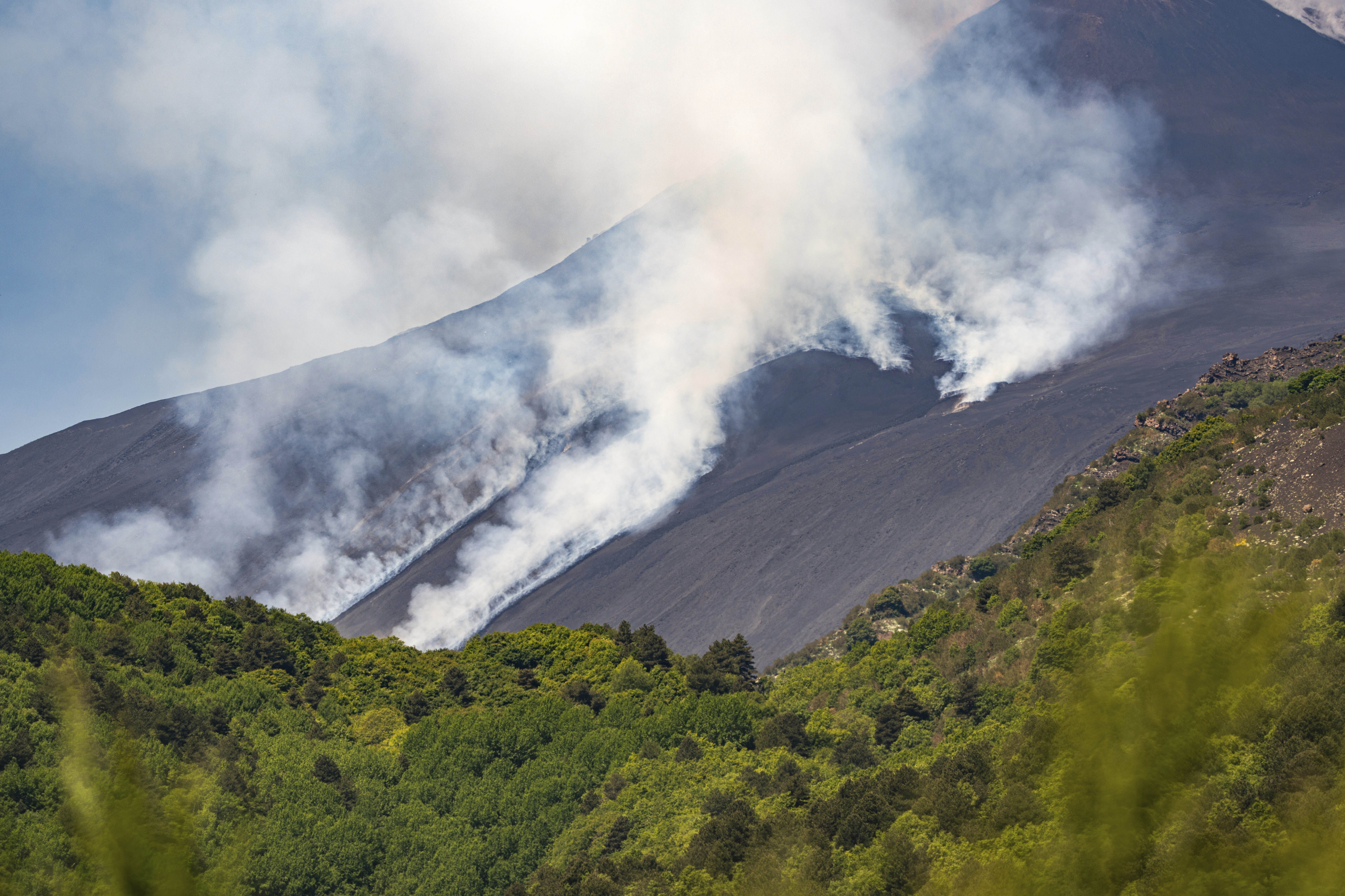 Smoke billows from Mount Etna volcano, Italy, Monday, June 2, 2025. (AP Photo/Giuseppe Distefano)