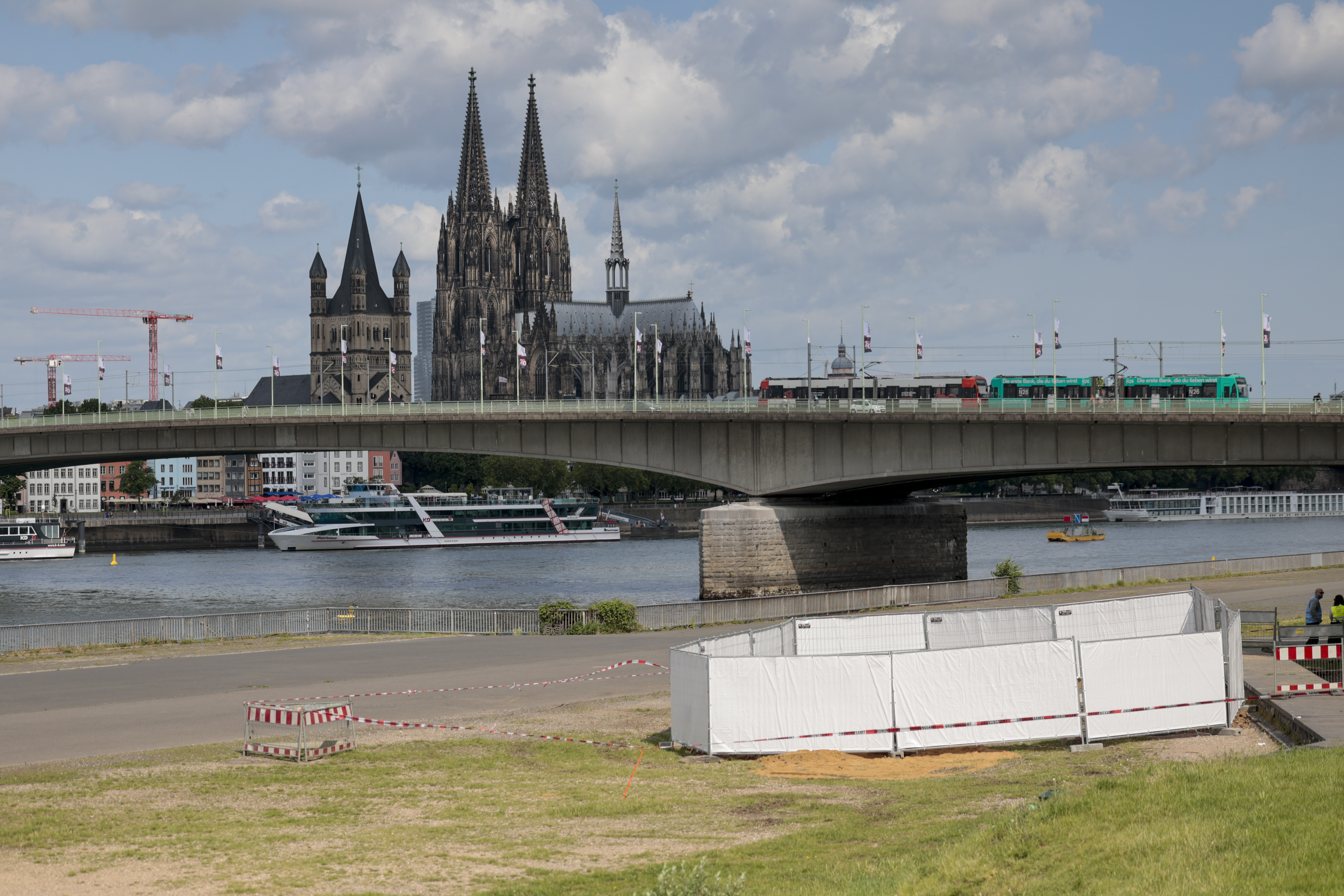 One of the three unexploded bombs from the Second World War is fenced off with screens as specialists prepare to defuse them in Cologne, Tuesday, June 3, 2025. (Thomas Banneyer/dpa via AP)