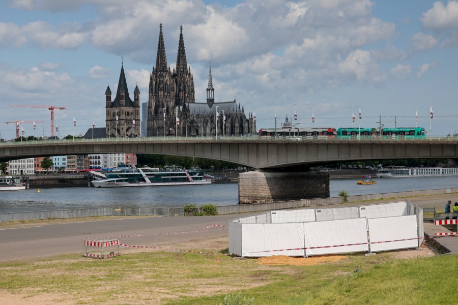 One of the three unexploded bombs from the Second World War is fenced off with screens as specialists prepare to defuse them in Cologne, Tuesday, June 3, 2025. (Thomas Banneyer/dpa via AP)
