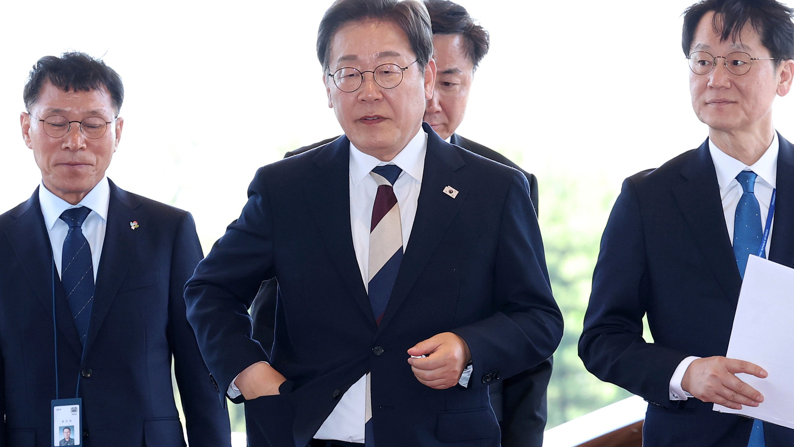 South Korean new President Lee Jae-myung, center, arrives at presidential office in Seoul after the inauguration Wednesday, June 4, 2025. (Chung Sung-Jun/Pool Photo via AP)
